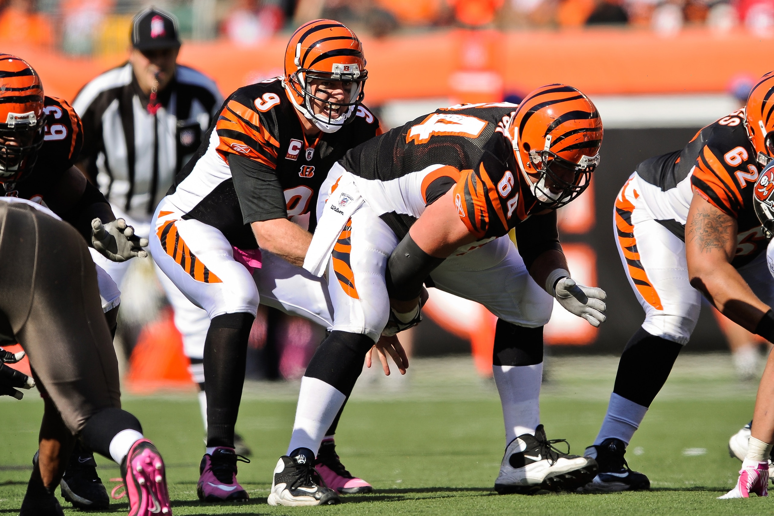 CINCINNATI, OH - OCTOBER 10: Quarterback Carson Palmer #9 of the Cincinnati Bengals takes the snap from center Kyle Cook #64 of the Cincinnati Bengals against the Tampa Bay Buccaneers at Paul Brown Stadium on October 10, 2010 in Cincinnati, Ohio. (Photo b