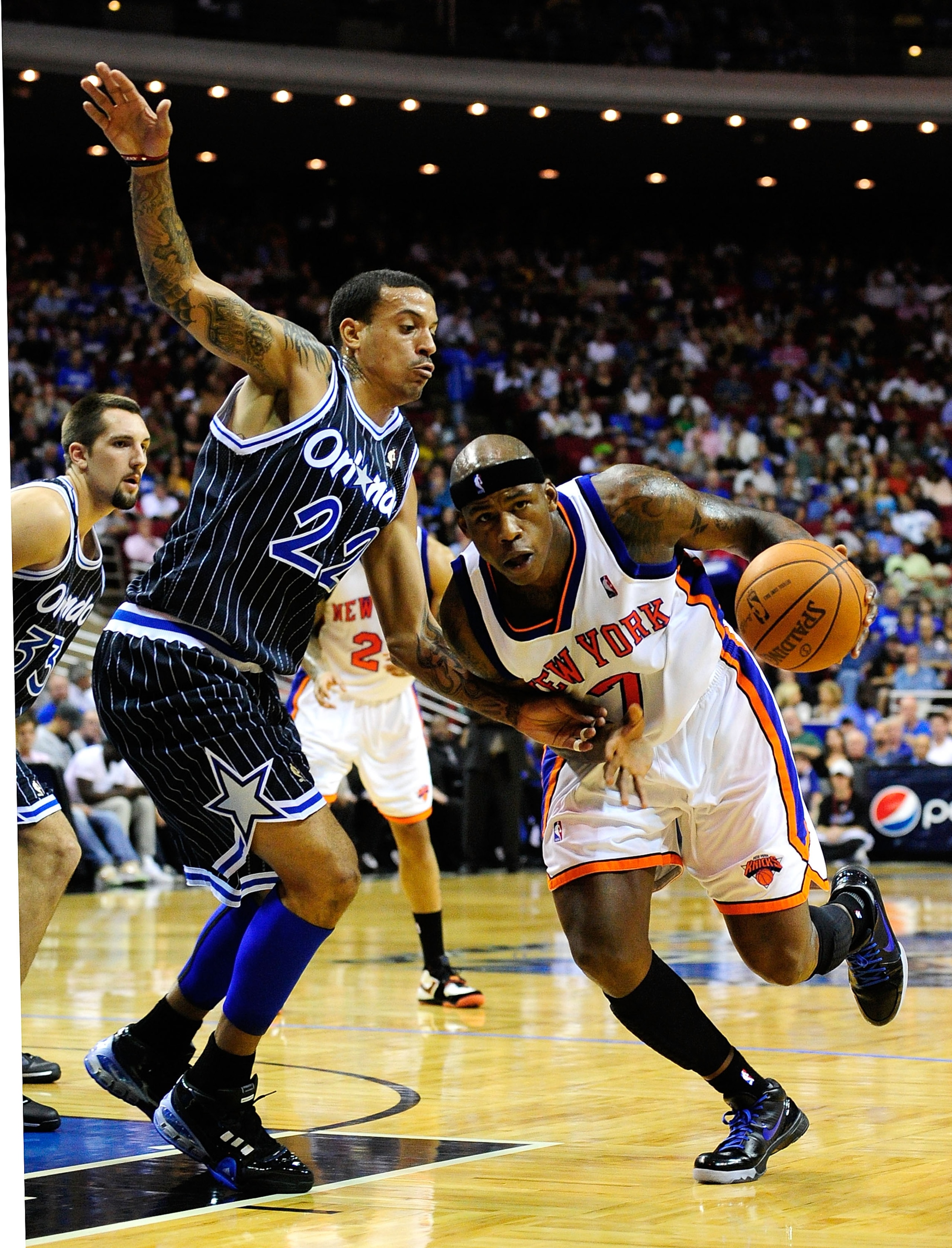 ORLANDO, FL - DECEMBER 02:  Al Harrington #7 of the New York Knicks drives against Matt Barnes #22 of the Orlando Magic during the game at Amway Arena on December 2, 2009 in Orlando, Florida.  NOTE TO USER: User expressly acknowledges and agrees that, by