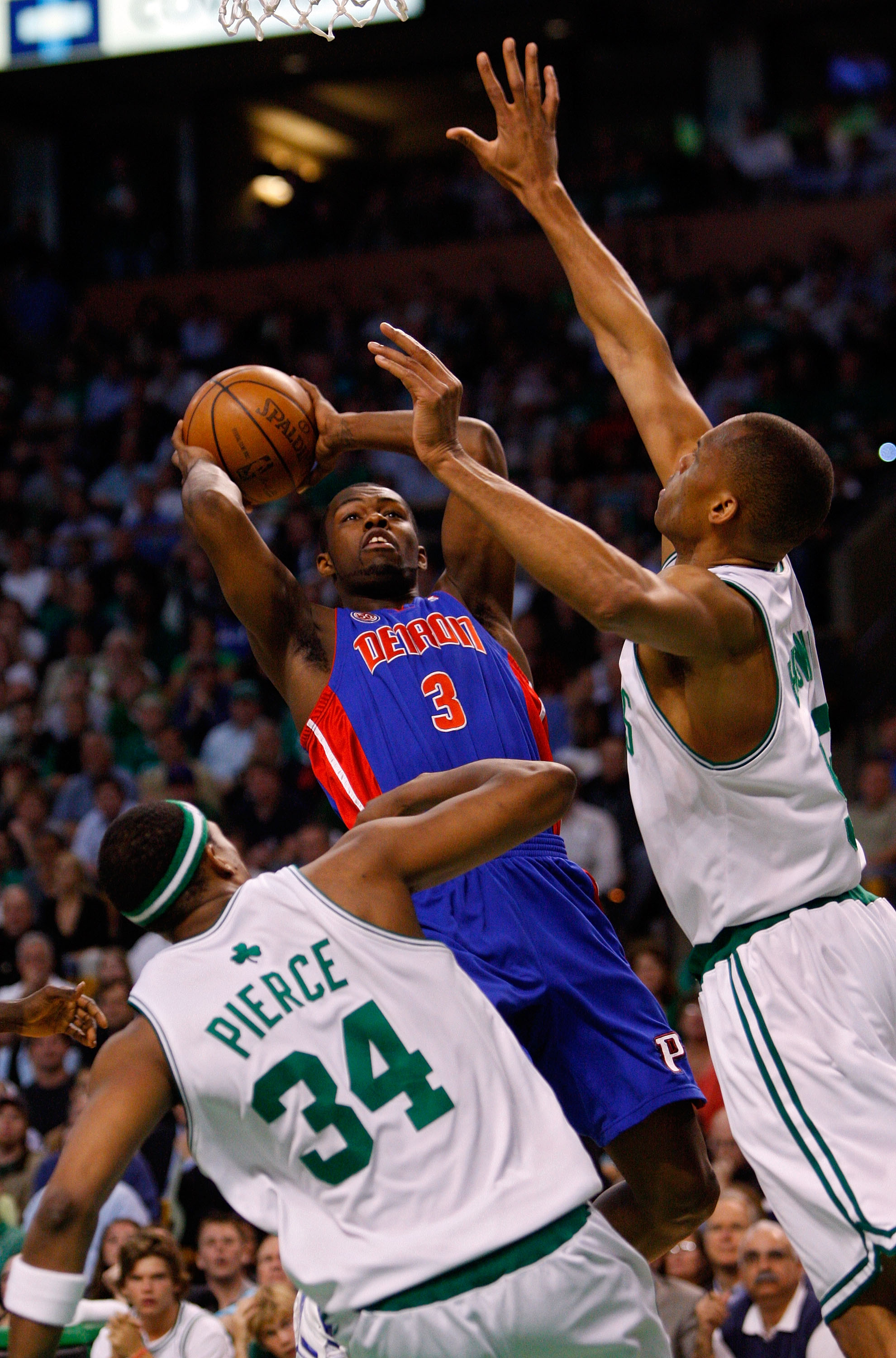 BOSTON - MAY 28:  Rodney Stuckey #3 of the Detroit Pistons shoots over P.J. Brown #93 and Paul Pierce #34 of the Boston Celtics during Game Five of the Eastern Conference finals during the 2008 NBA Playoffs at TD Banknorth Garden on May 28, 2008 in Boston