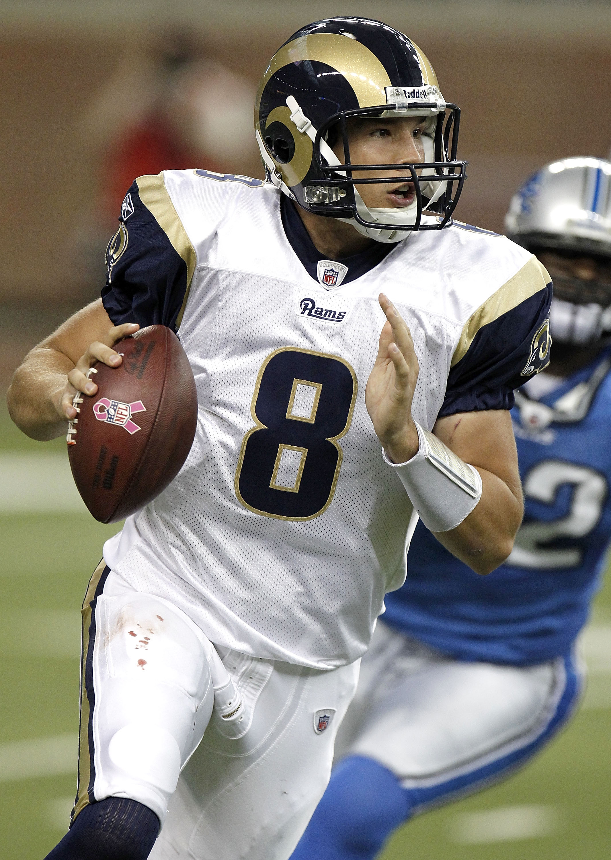 DETROIT - OCTOBER 10: Sam Bradford #8 of the St. Louis Rams looks for a open receiver while playing the Detroit Lions on October 10, 2010 at Ford Field in Detroit, Michigan.  (Photo by Gregory Shamus/Getty Images)