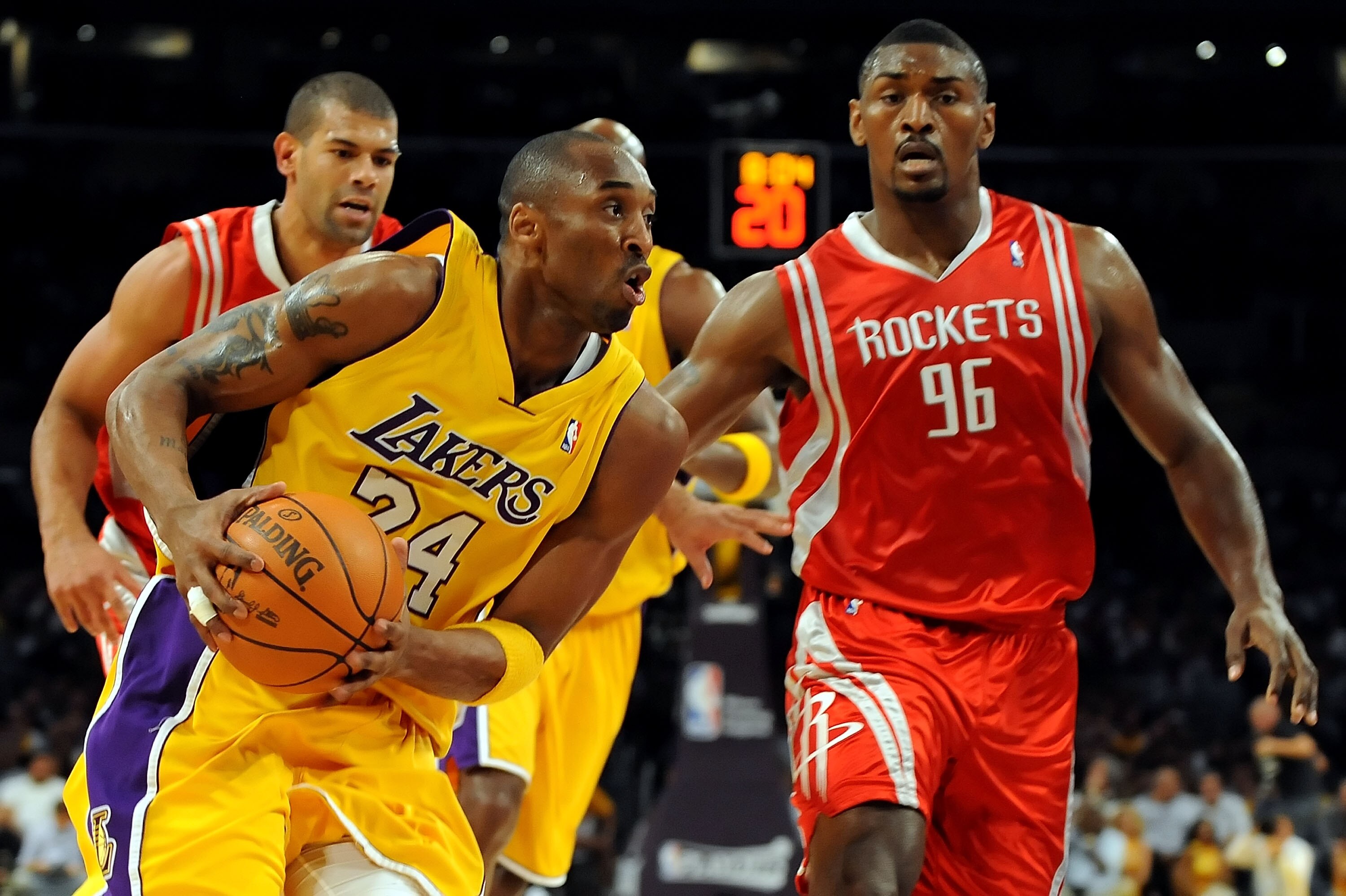 LOS ANGELES, CA - MAY 06:  Kobe Bryant #24 of the Los Angeles Lakers drives between (R) Ron Artest #96 and Shane Battier #31 of the Houston Rockets in the first half of Game Two of the Western Conference Semifinals during the 2009 NBA Playoffs at Staples 