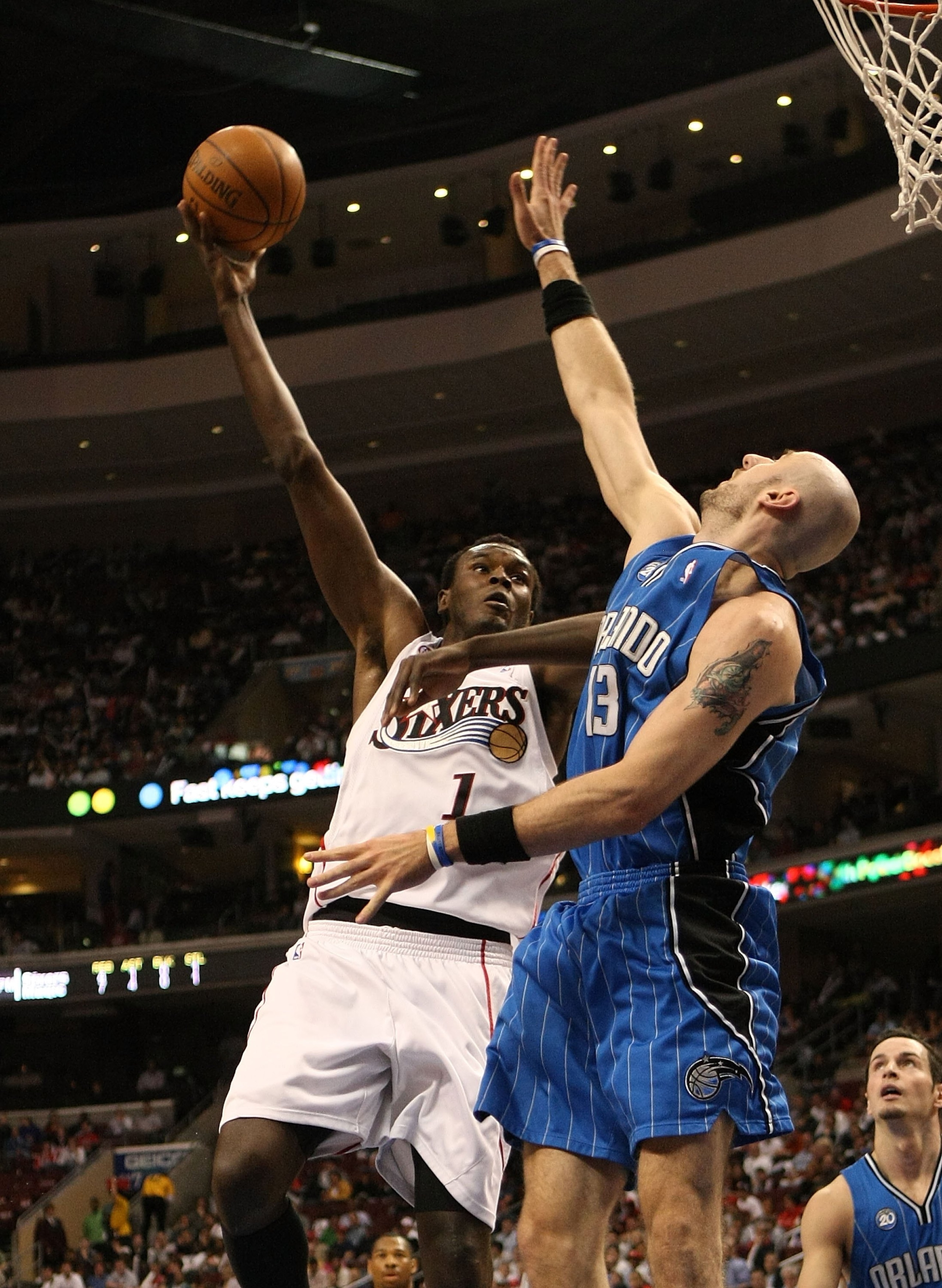 PHILADELPHIA - APRIL 30:  Samuel Dalembert #1 of the Philadelphia 76ers shoots over Marcin Gortat #13 of the Orlando Magic during Game Six of the Eastern Conference Quarterfinals at Wachovia Center on April 30, 2009 in Philadelphia, Pennsylvania. NOTE TO