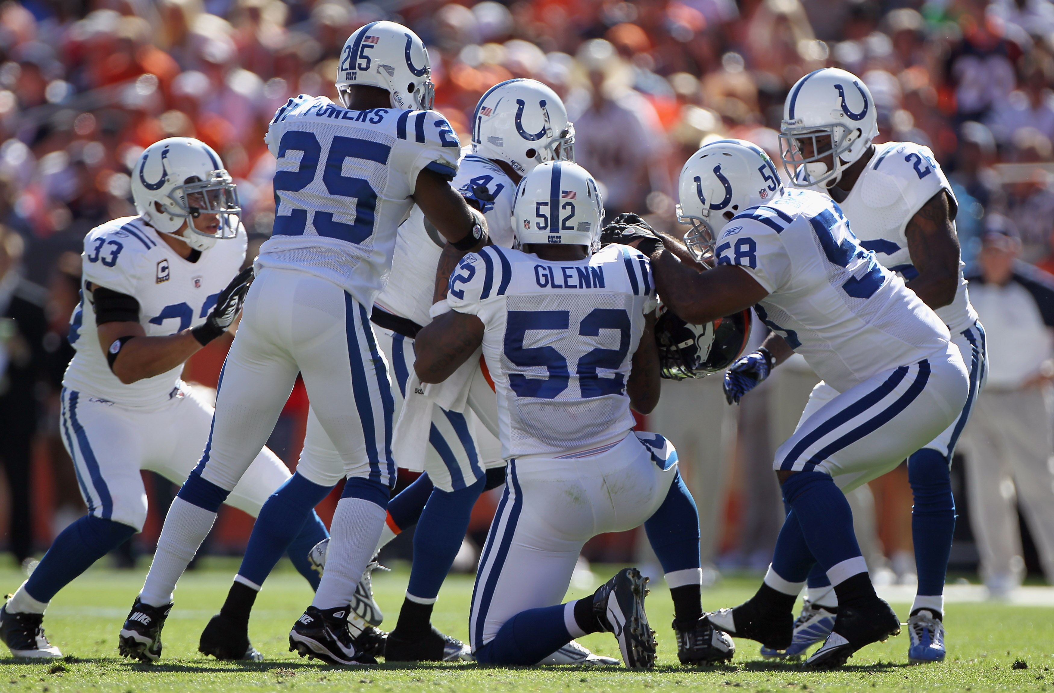 DENVER - SEPTEMBER 26:  The Indianapolis Colts defense stops wide receiver Jabar Gaffney #10 of the Denver Broncos after a pass reception at INVESCO Field at Mile High on September 26, 2010 in Denver, Colorado.  (Photo by Doug Pensinger/Getty Images)