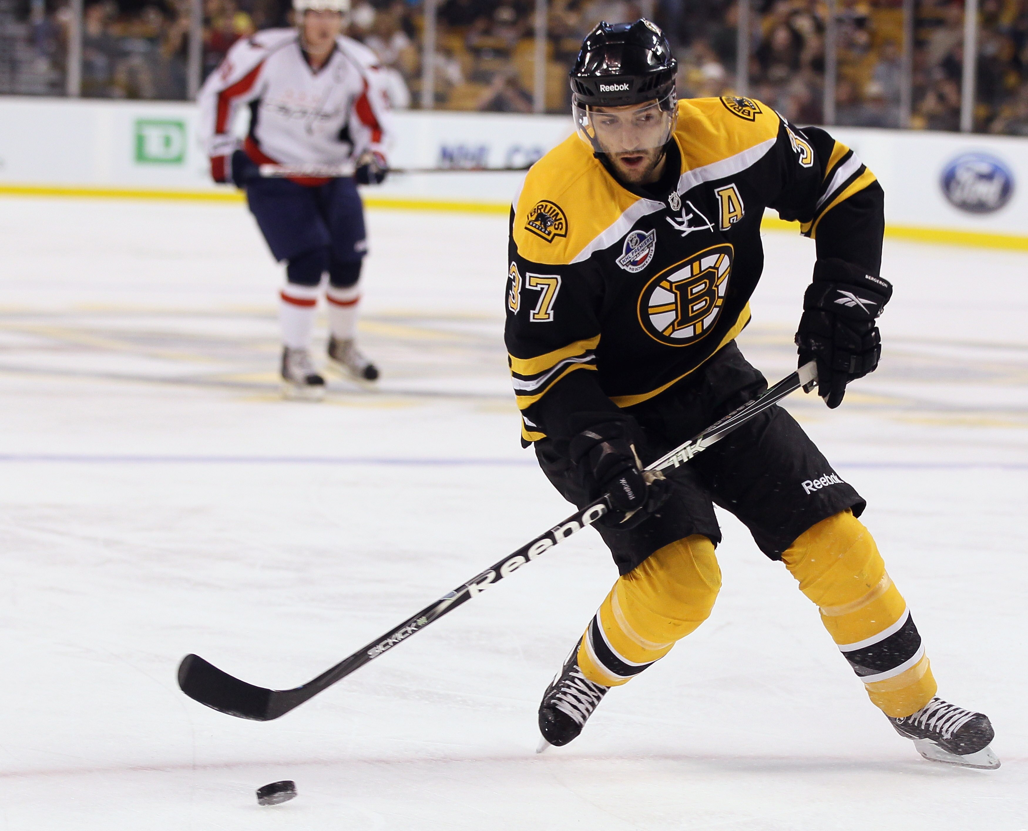 BOSTON - SEPTEMBER 29:  Patrice Bergeron #37 of the Boston Bruins heads for the net against the Washington Capitals on September 29, 2010 at the TD Garden in Boston, Massachusetts.  (Photo by Elsa/Getty Images)