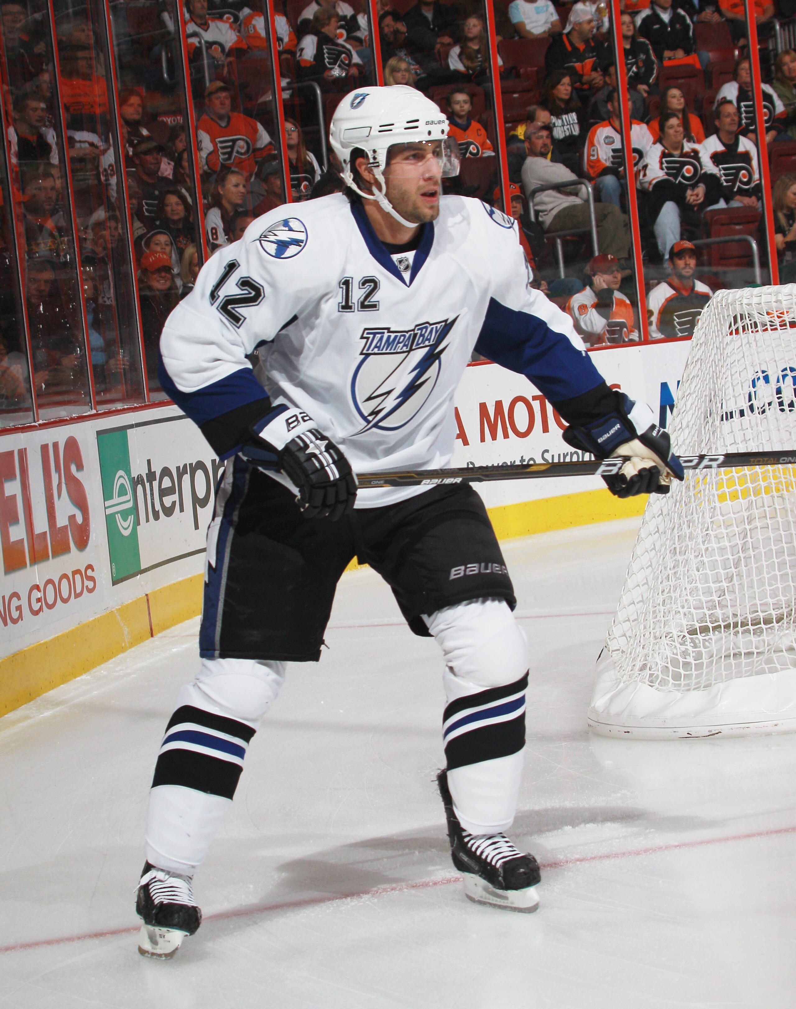PHILADELPHIA - OCTOBER 14:  Simon Gagne #12 of the Tampa Bay Lightning skates against the Philadelphia Flyers at the Wells Fargo Center on October 14, 2010 in Philadelphia, Pennsylvania.  (Photo by Bruce Bennett/Getty Images)