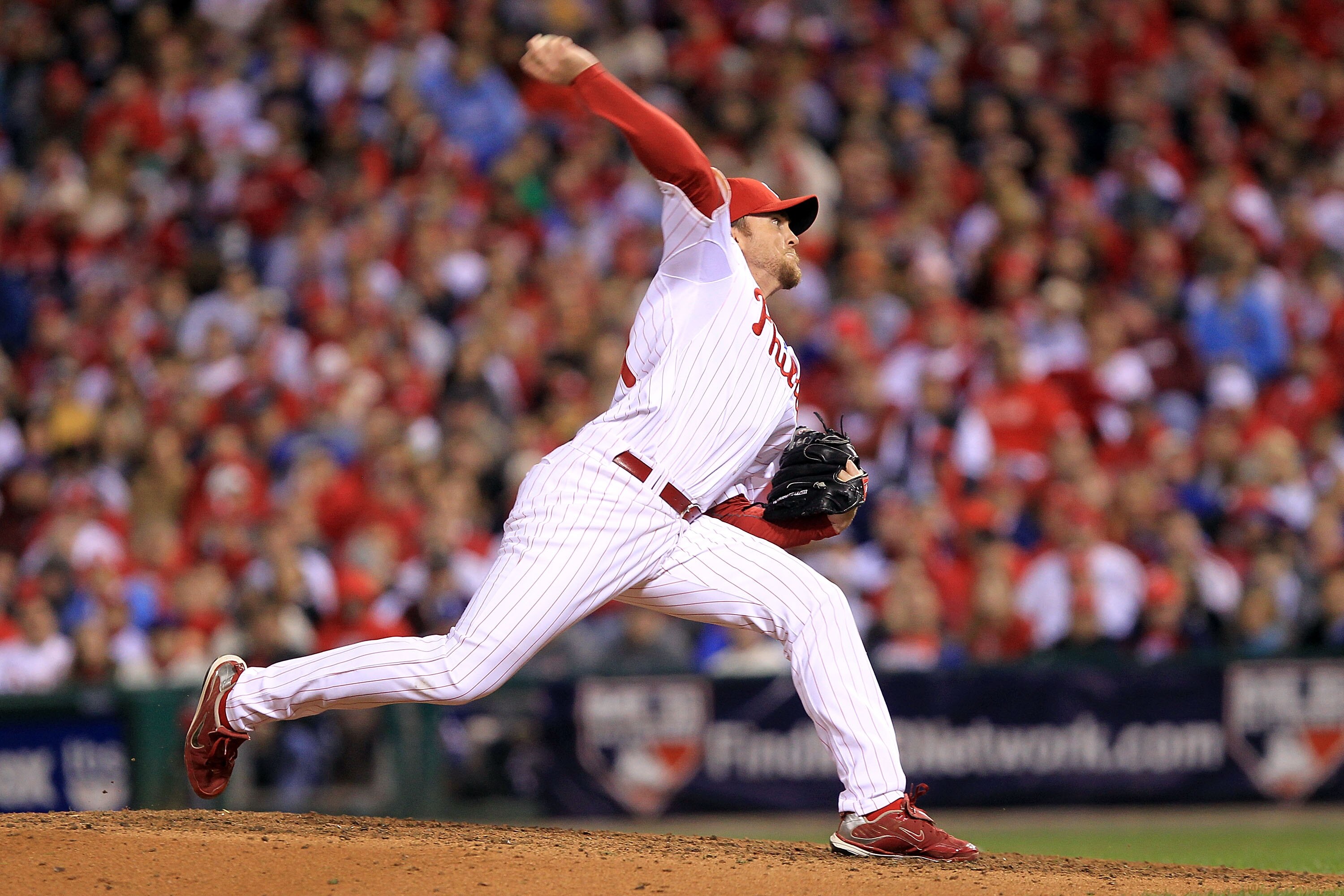 PHILADELPHIA - OCTOBER 16:  Brad Lidge #54 of the Philadelphia Phillies pitches in the ninth inning against the San Francisco Giants in Game One of the NLCS during the 2010 MLB Playoffs at Citizens Bank Park on October 16, 2010 in Philadelphia, Pennsylvan