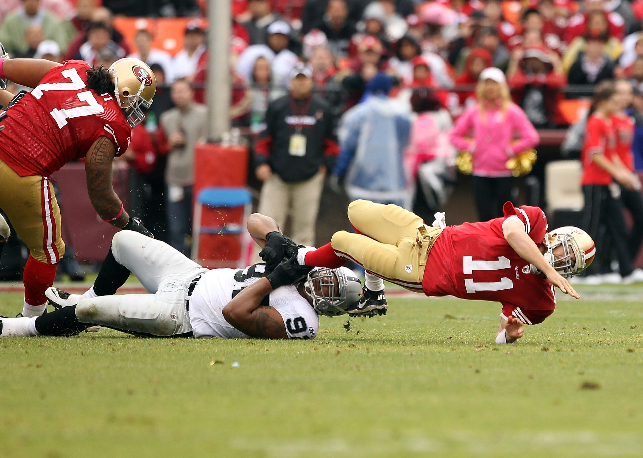SAN FRANCISCO - OCTOBER 17:  Richard Seymour #92 of the Oakland Raiders tackles Alex Smith #11 of the San Francisco 49ers at Candlestick Park on October 17, 2010 in San Francisco, California. (Photo by Ezra Shaw/Getty Images)