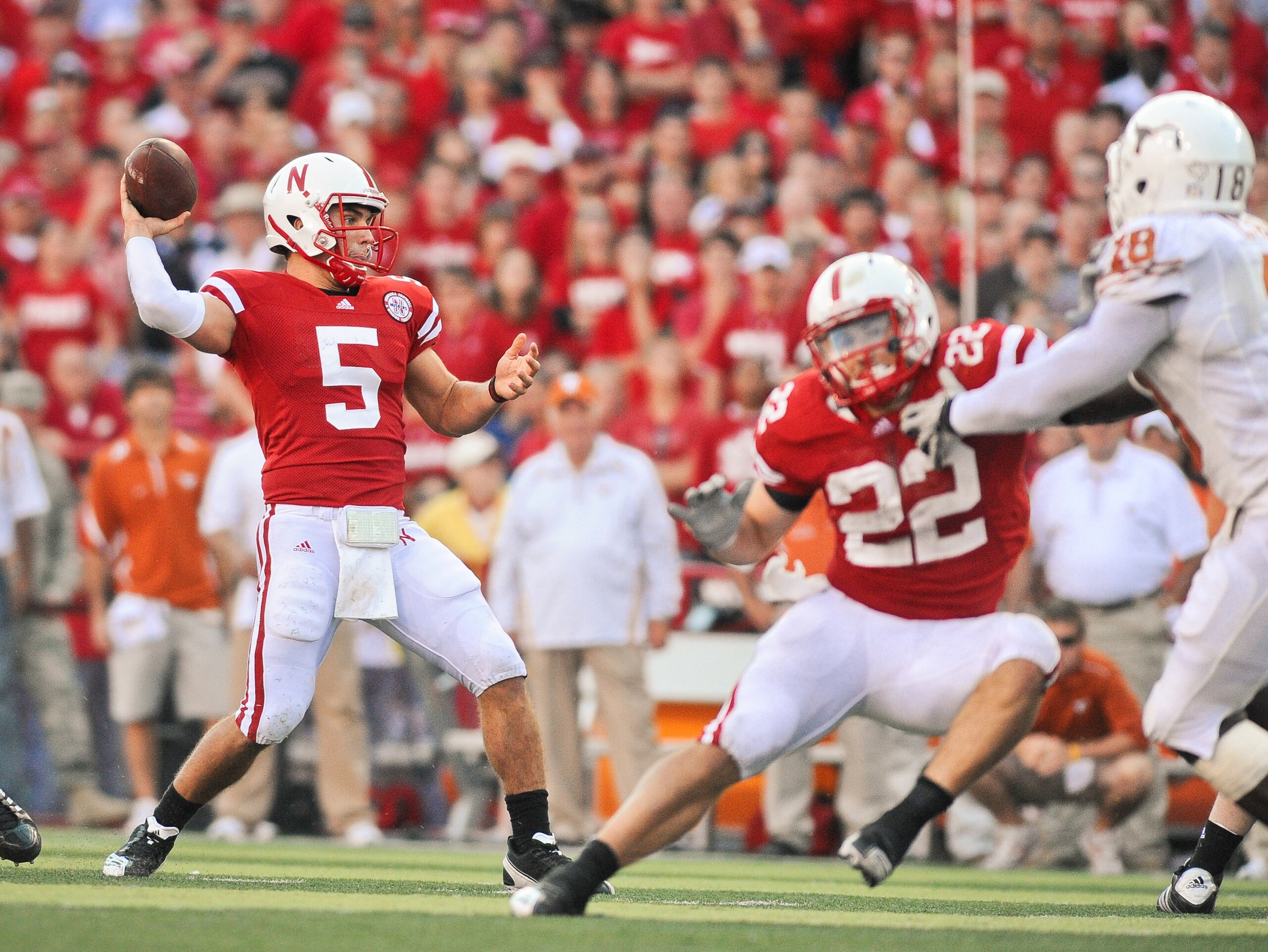 LINCOLN, NE - OCTOBER 16: Quarterback Zac Lee #5 of the Nebraska Cornhuskers throws downfield as teammate Rex Burkhead blocks during their game at Memorial Stadium on October 16, 2010 in Lincoln, Nebraska. Texas Defeated Nebraska 20-13. (Photo by Eric Fra