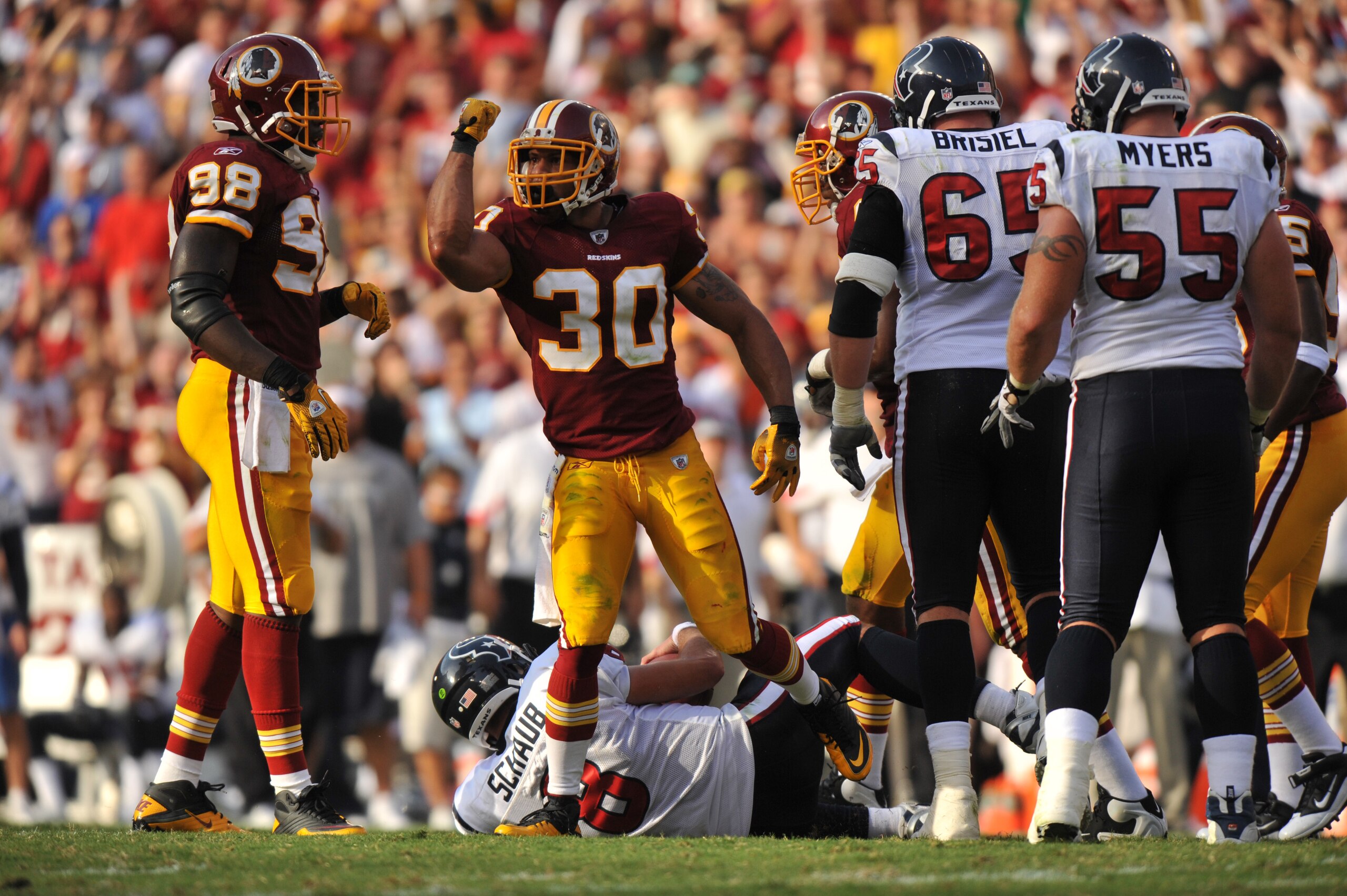 LANDOVER, MD - SEPTEMBER 19:  LaRon Landry #30 of the Washington Redskins celebrates a sack of Matt Schaub #8 of the Houston Texans at FedExField on September 19, 2010 in Landover, Maryland. The Redskins lead the Texans at the half 20-7. (Photo by Larry F