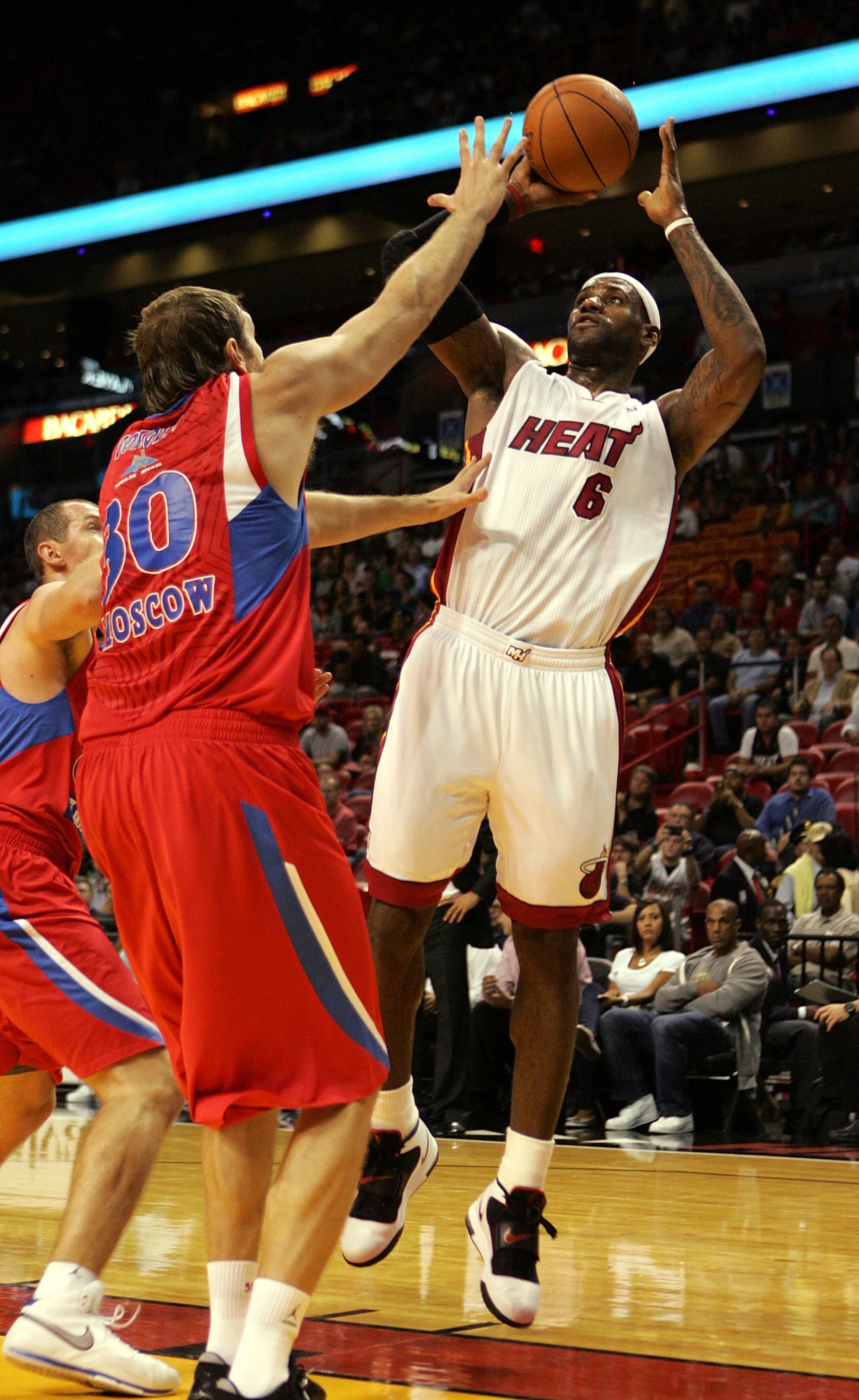 MIAMI - OCTOBER 12:  Forward LeBron James #6 shoots over center Dmitry Sokolov #30 of CSKA Moskow on October 12, 2010 in Miami, Florida.  NOTE TO USER: User expressly acknowledges and agrees that, by downloading and or using this photograph, User is conse