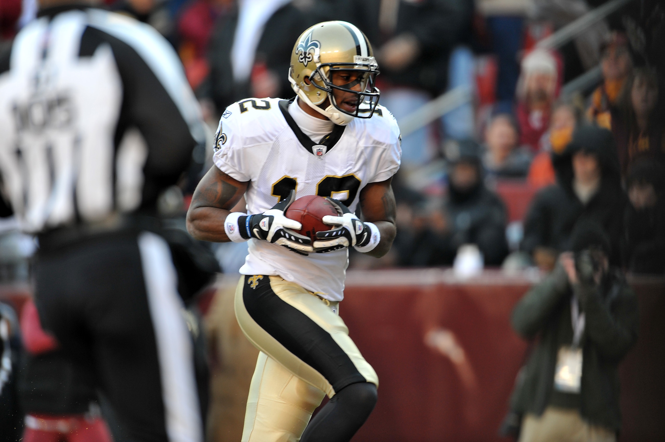 LANDOVER, MD - DECEMBER 6:  Marques Colston #12 of the New Orleans Saints scores the Saints first touchdown against the Washington Redskins at FedExField on December 6, 2009 in Landover, Maryland. (Photo by Larry French/Getty Images)