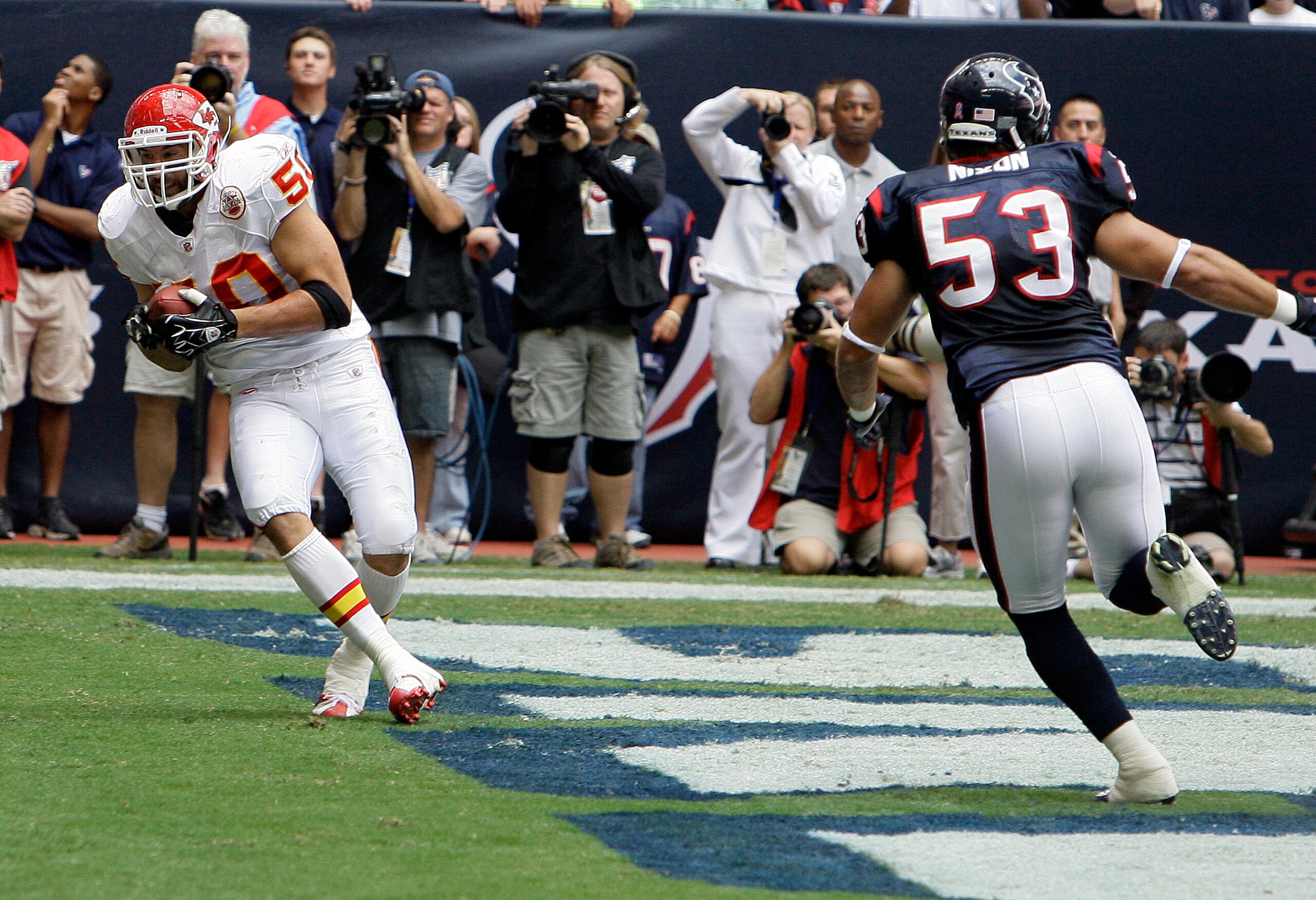 HOUSTON - OCTOBER 17:  Mike Vrabel #50 of the Kansas City Chiefs scores on a pass in the first quarter as he gets behind linebacker David Nixon #53 of the Houston Texans at Reliant Stadium on October 17, 2010 in Houston, Texas.  (Photo by Bob Levey/Getty