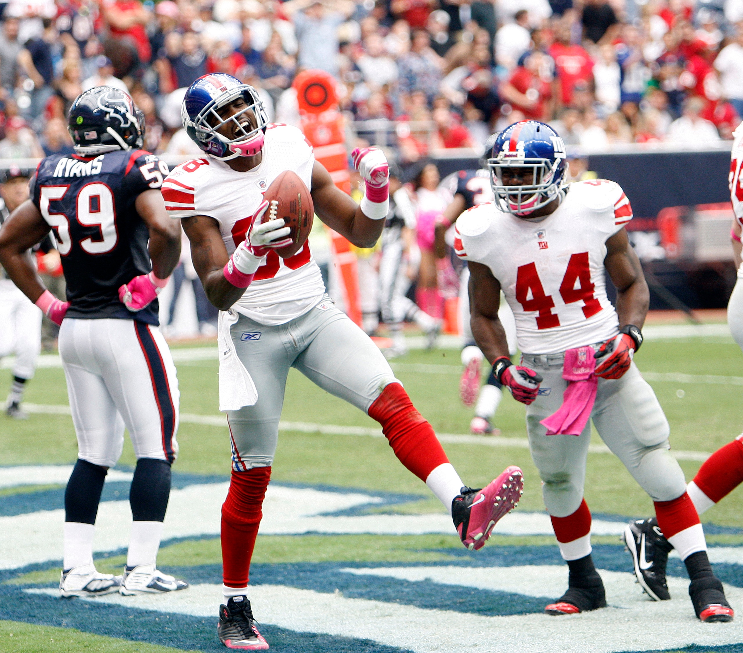 HOUSTON - OCTOBER 10:  Wide receiver Hakeem Nicks #88 celebrates with Ahmad Bradshaw #44 after scoring on a passs in the second quarter at Reliant Stadium on October 10, 2010 in Houston, Texas.  (Photo by Bob Levey/Getty Images)