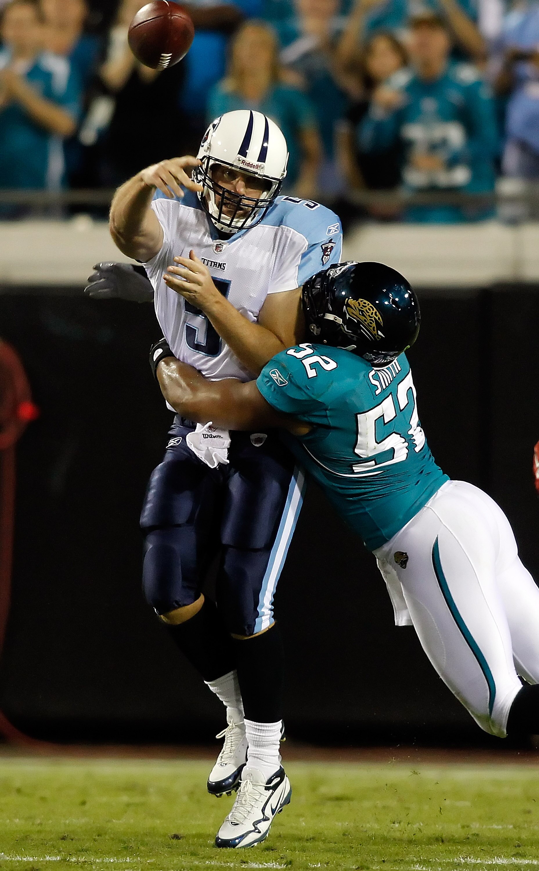 JACKSONVILLE, FL - OCTOBER 18:  Quarterback Kerry Collins #5 of the Tennessee Titans is hit by linebacker Daryl Smith #52 of the Jacksonville Jaguars during the game at EverBank Field on October 18, 2010 in Jacksonville, Florida.  (Photo by J. Meric/Getty
