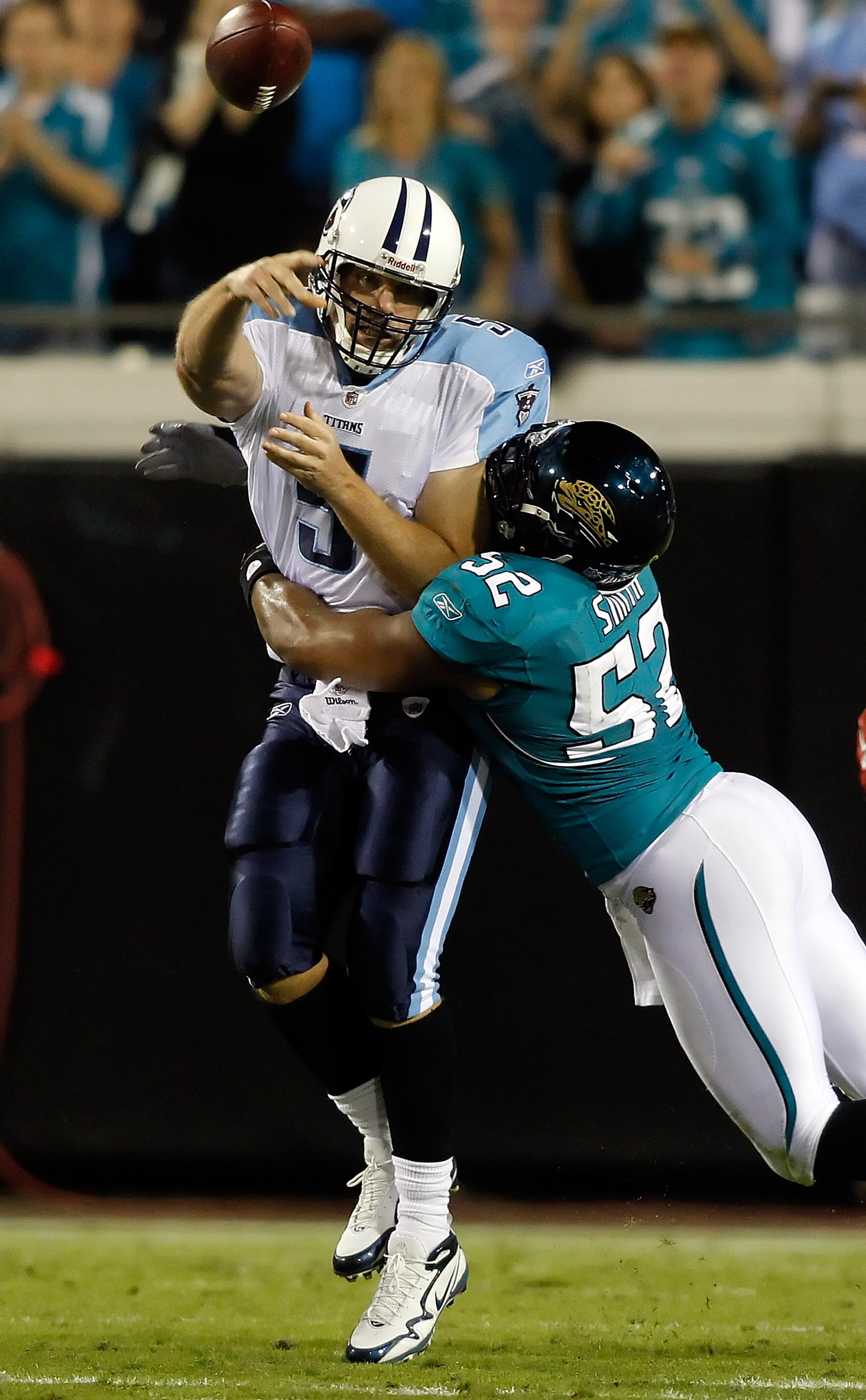 JACKSONVILLE, FL - OCTOBER 18:  Quarterback Kerry Collins #5 of the Tennessee Titans is hit by linebacker Daryl Smith #52 of the Jacksonville Jaguars during the game at EverBank Field on October 18, 2010 in Jacksonville, Florida.  (Photo by J. Meric/Getty