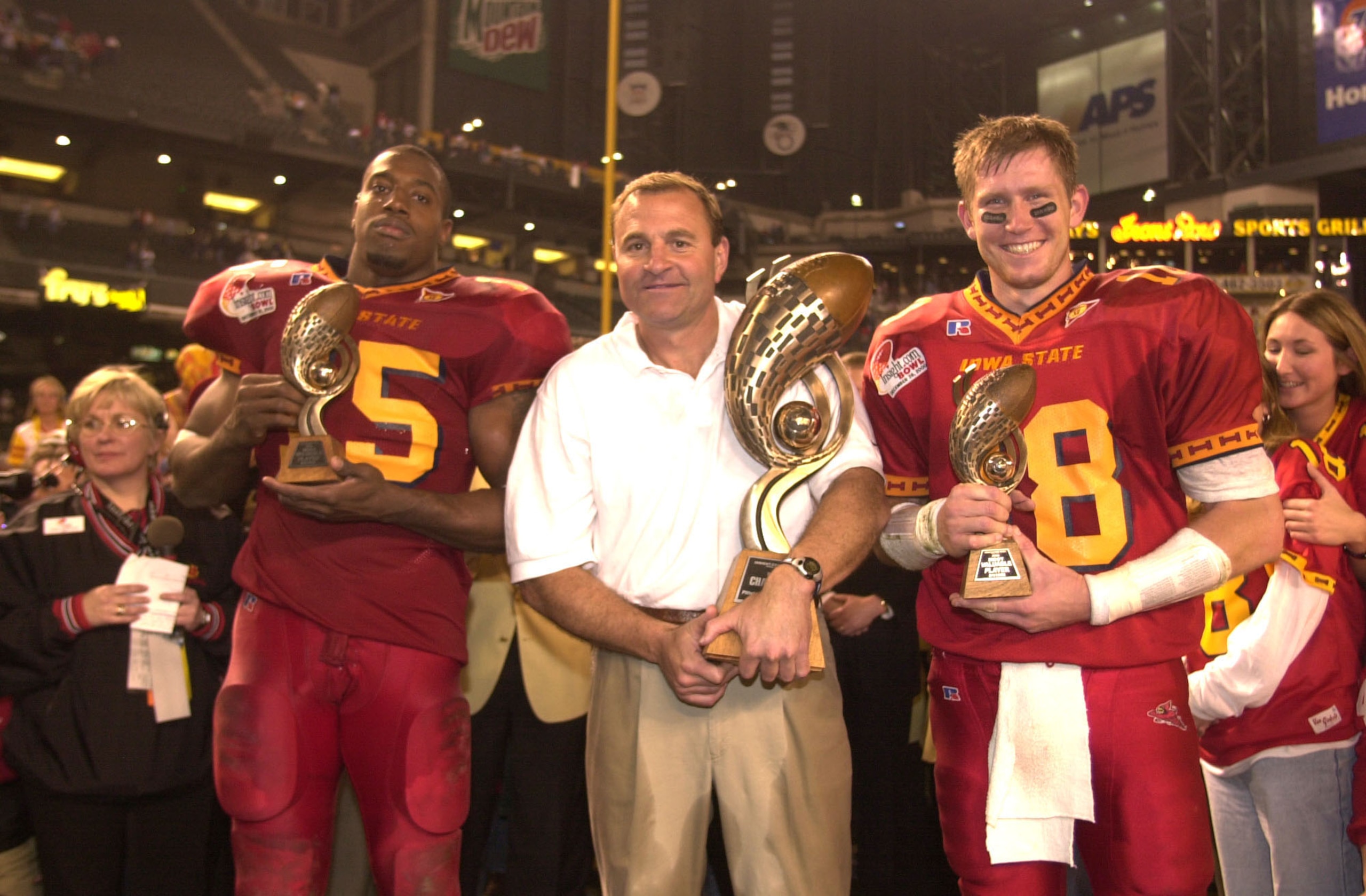 28 Dec 2000:  (L-R) Reggie Haywood #15, head coach Dan McCarney and Sage Rosenfels #18 of Iowa State pose with the trophies in celebration of their 37-29 victory over Pittsburgh during the Insight.com Bowl at Bank One Ballpark in Phoenix, Arizona.  DIGITA