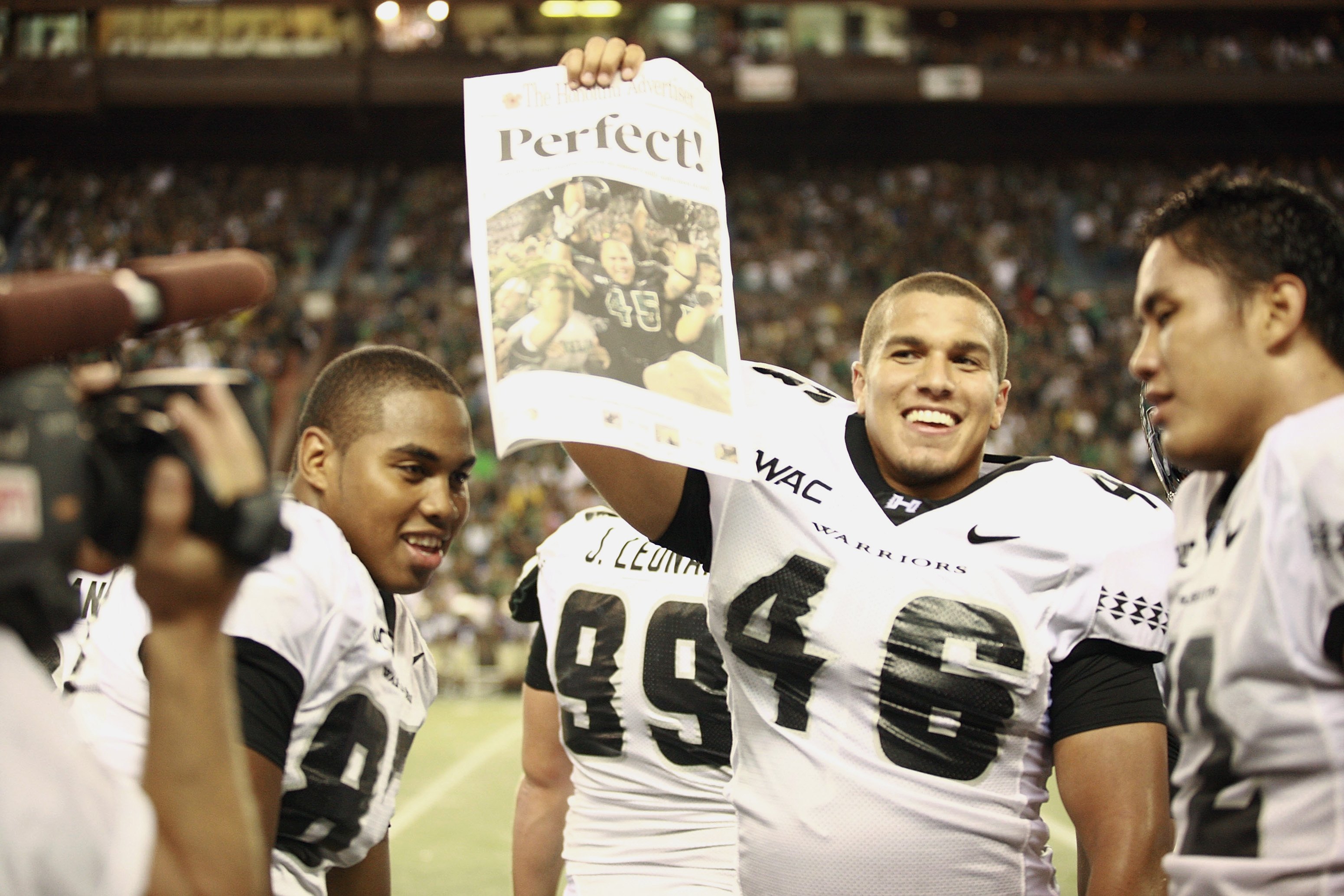 HONOLULU - DECEMBER 2:   Victor Clore #46 of the Hawaii Warriors celebrates the victory against the Washington Huskies on December 1, 2007 at Aloha Stadium in Honolulu, Hawaii.  Hawaii won 35-28 and finished the season undefeated at 12-0.  (Photo by Willi