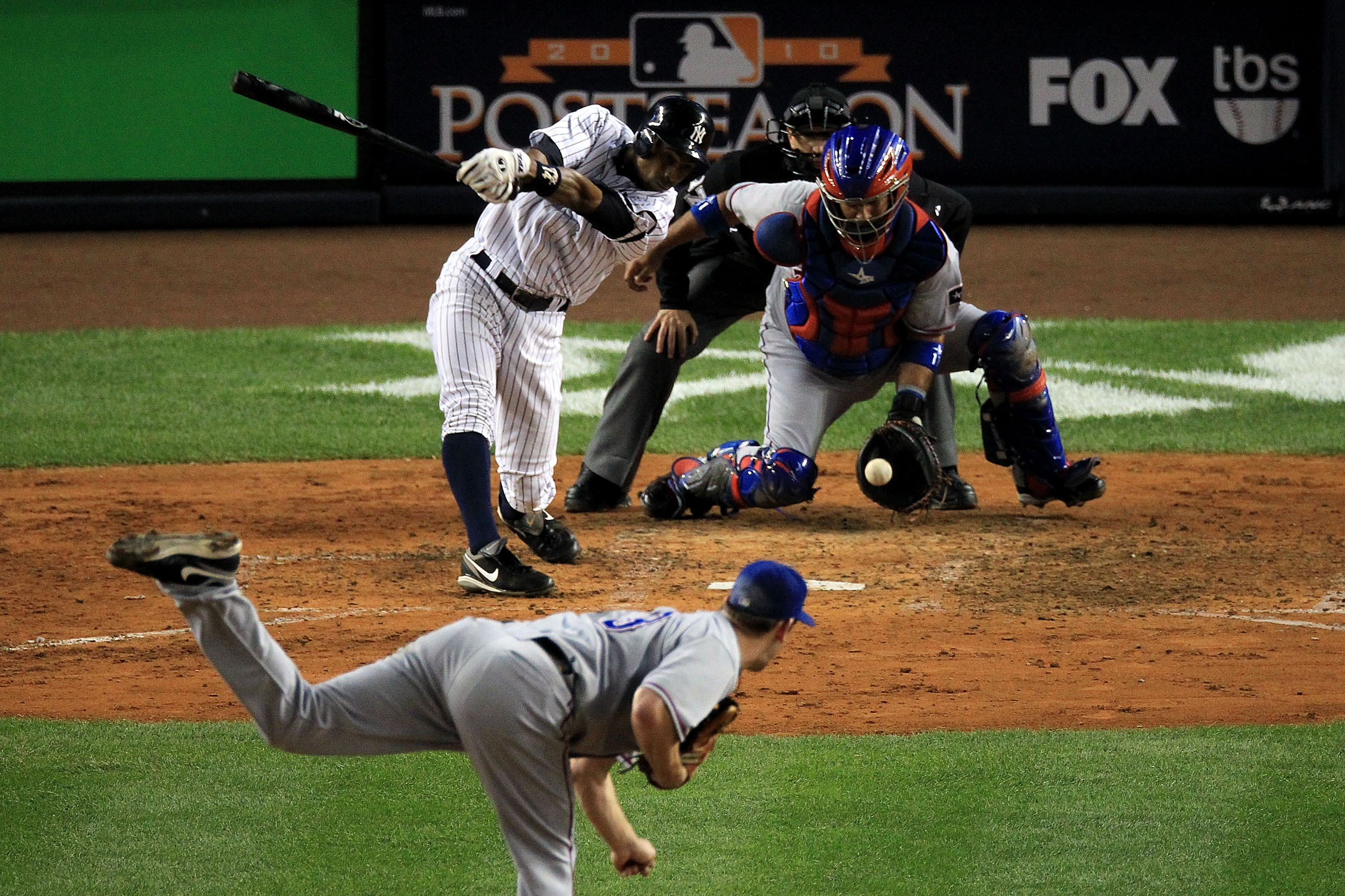 NEW YORK - OCTOBER 18:  Curtis Granderson #14 of the New York Yankees strikes out against Cliff Lee #33 of the Texas Rangers in Game Three of the ALCS during the 2010 MLB Playoffs at Yankee Stadium on October 18, 2010 in New York, New York.  (Photo by Tra
