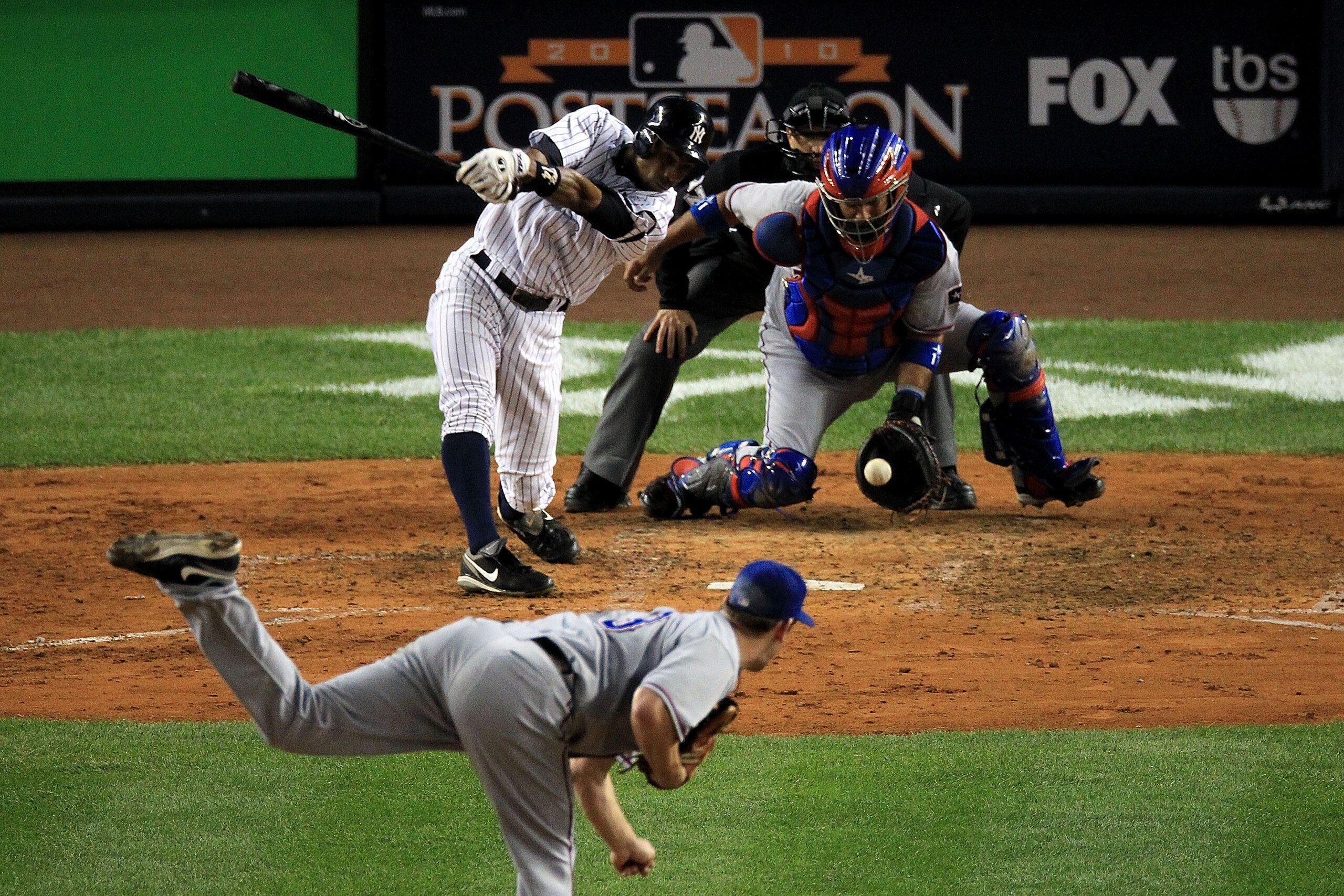 NEW YORK - OCTOBER 18:  Curtis Granderson #14 of the New York Yankees strikes out against Cliff Lee #33 of the Texas Rangers in Game Three of the ALCS during the 2010 MLB Playoffs at Yankee Stadium on October 18, 2010 in New York, New York.  (Photo by Tra