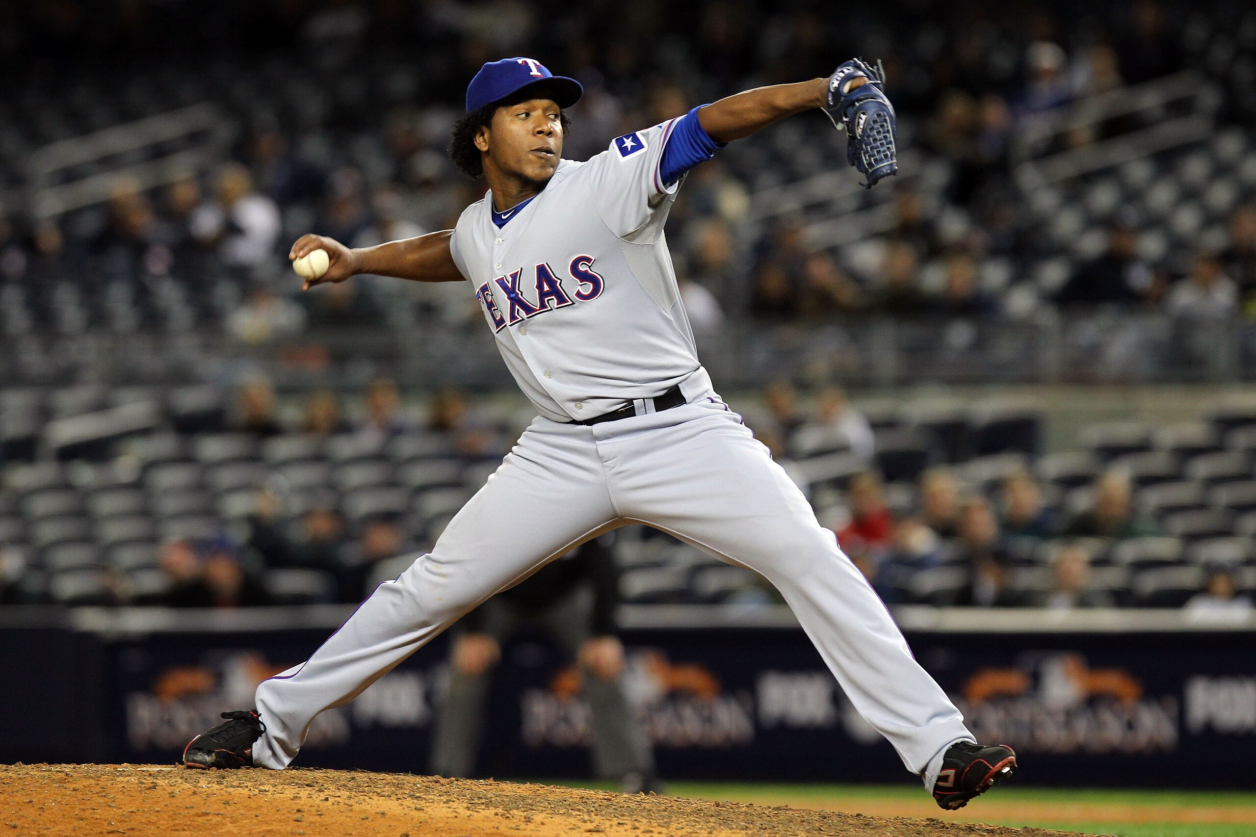 NEW YORK - OCTOBER 18: Neftali Feliz #30 ofthe Texas Rangers pitches against the New York Yankees in Game Three of the ALCS during the 2010 MLB Playoffs at Yankee Stadium on October 18, 2010 in New York, New York. The Rangers won 8-0. (Photo by Nick Lah NEW YORK - OCTOBER 18: Neftali Feliz #30 ofthe Texas Rangers pitches against the New York Yankees in Game Three of the ALCS during the 2010 MLB Playoffs at Yankee Stadium on October 18, 2010 in New York, New York. The Rangers won 8-0. (Photo by Nick Lah