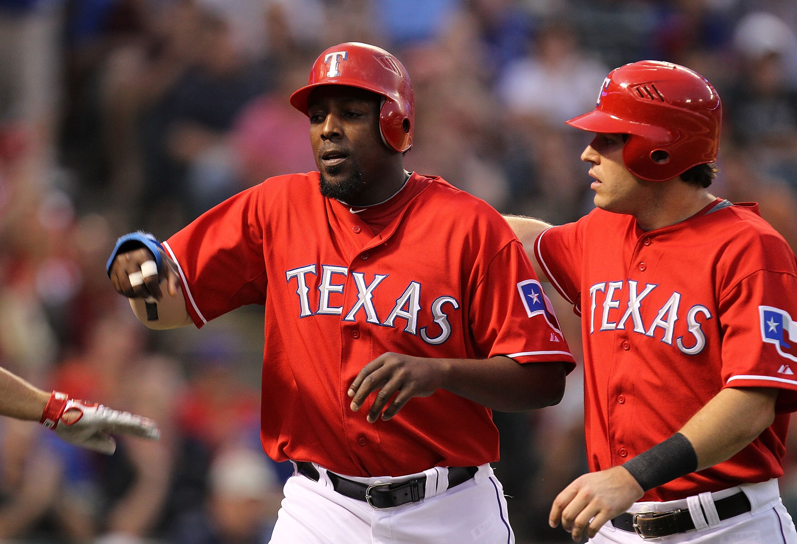 ARLINGTON, TX - MAY 17: (L-R) Vladimir Guerrero #27 and Ian Kinsler #5 of the Texas Rangers celebrate after scoring against the Los Angeles Angels of Anaheim on May 17, 2010 at Rangers Ballpark in Arlington, Texas. (Photo by Ronald Martinez/Getty Images ARLINGTON, TX - MAY 17: (L-R) Vladimir Guerrero #27 and Ian Kinsler #5 of the Texas Rangers celebrate after scoring against the Los Angeles Angels of Anaheim on May 17, 2010 at Rangers Ballpark in Arlington, Texas. (Photo by Ronald Martinez/Getty Images