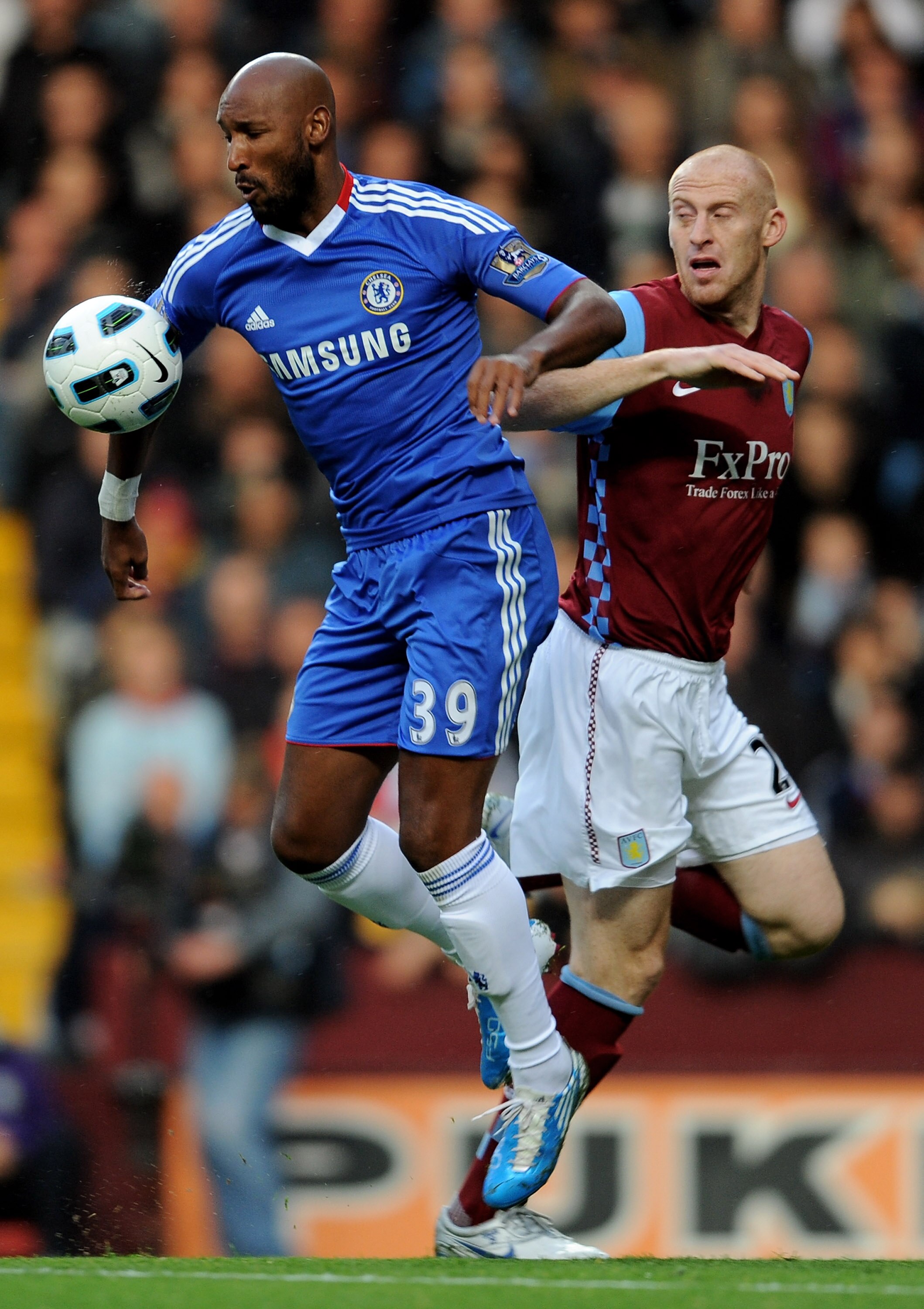 BIRMINGHAM, ENGLAND - OCTOBER 16:  James Collins of Aston Villa competes for the ball with Nicolas Anelka of Chelsea during the Barclays Premier League match between Aston Villa and Chelsea at Villa Park on October 16, 2010 in Birmingham, England.  (Photo