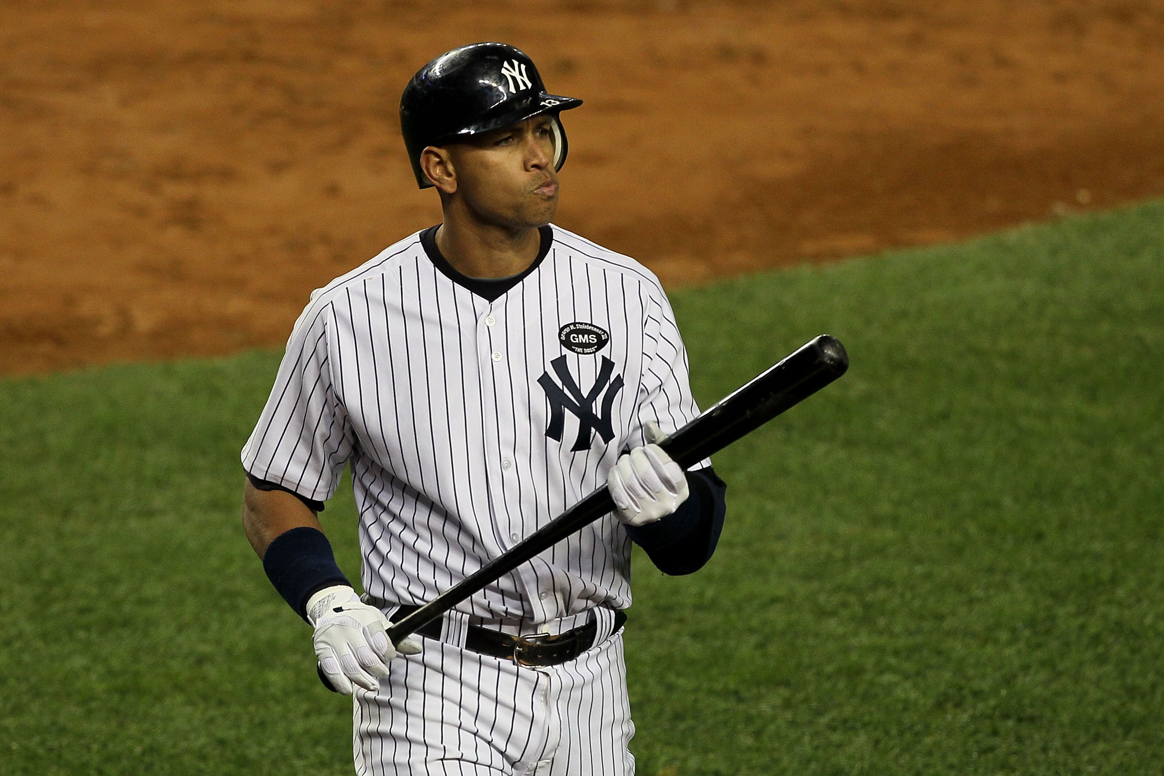 NEW YORK - OCTOBER 18:  Alex Rodriguez #13 of the New York Yankees reacts as he walks back to the dugout after he struck out in the bottom of the seocnd inning against the Texas Rangers in Game Three of the ALCS during the 2010 MLB Playoffs at Yankee Stad