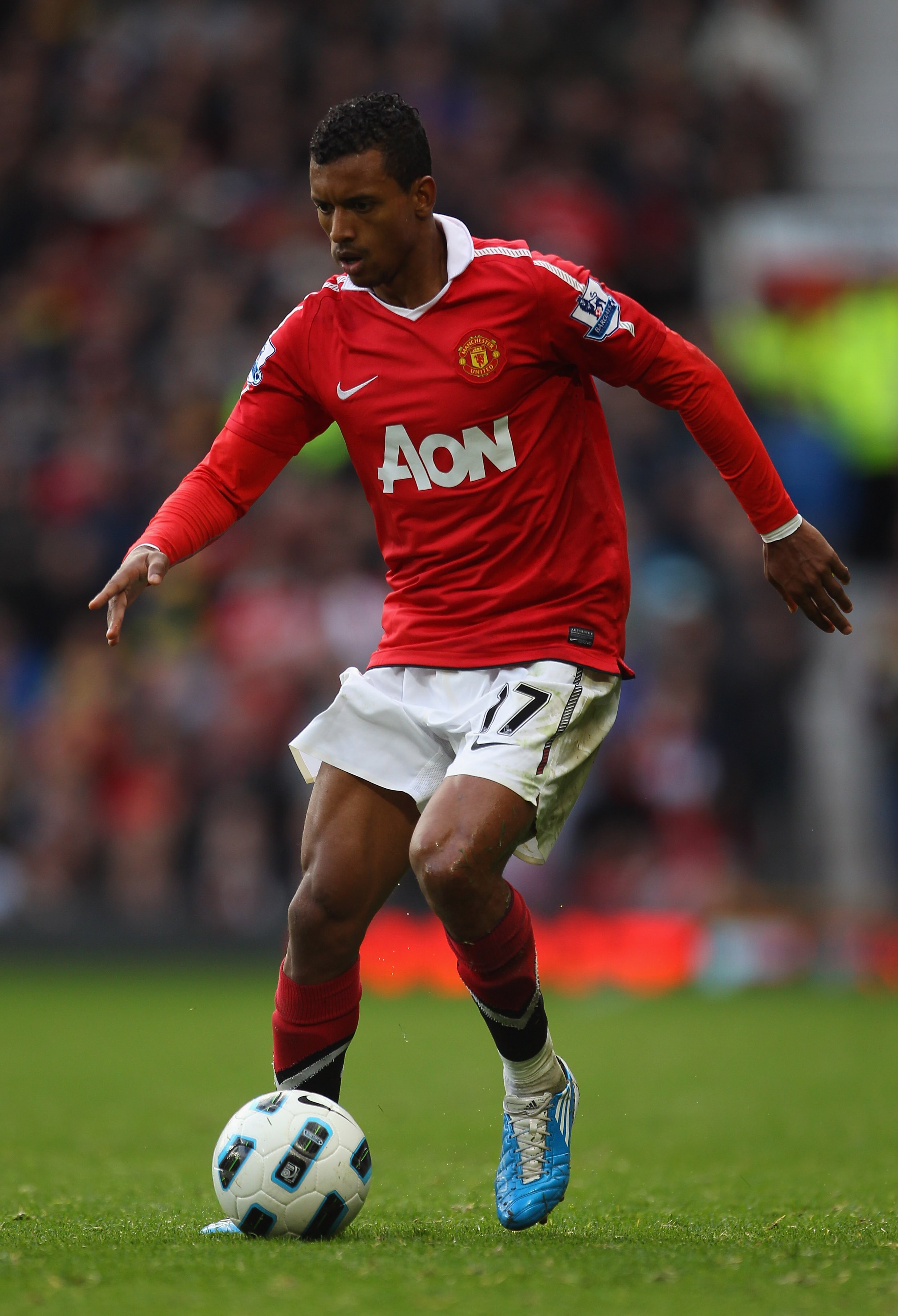 MANCHESTER, ENGLAND - OCTOBER 16:  Nani of Manchester United runs with the ball during the Barclays Premier League match between Manchester United and West Bromwich Albion at Old Trafford on October 16, 2010 in Manchester, England.  (Photo by Alex Livesey
