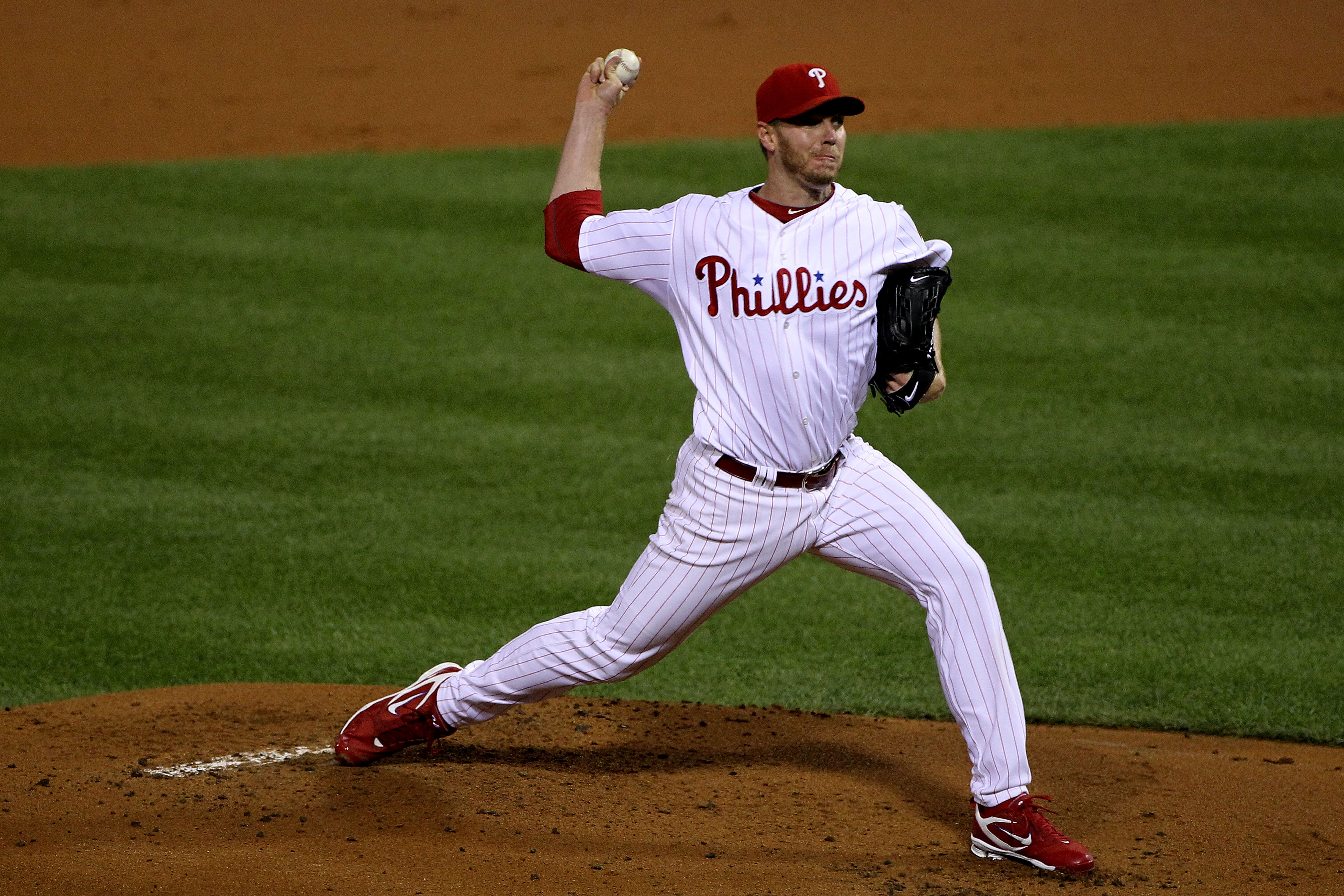 PHILADELPHIA - OCTOBER 16:  Roy Halladay #34 of the Philadelphia Phillies pitches in the first inning against the San Francisco Giants in Game One of the NLCS during the 2010 MLB Playoffs at Citizens Bank Park on October 16, 2010 in Philadelphia, Pennsylv