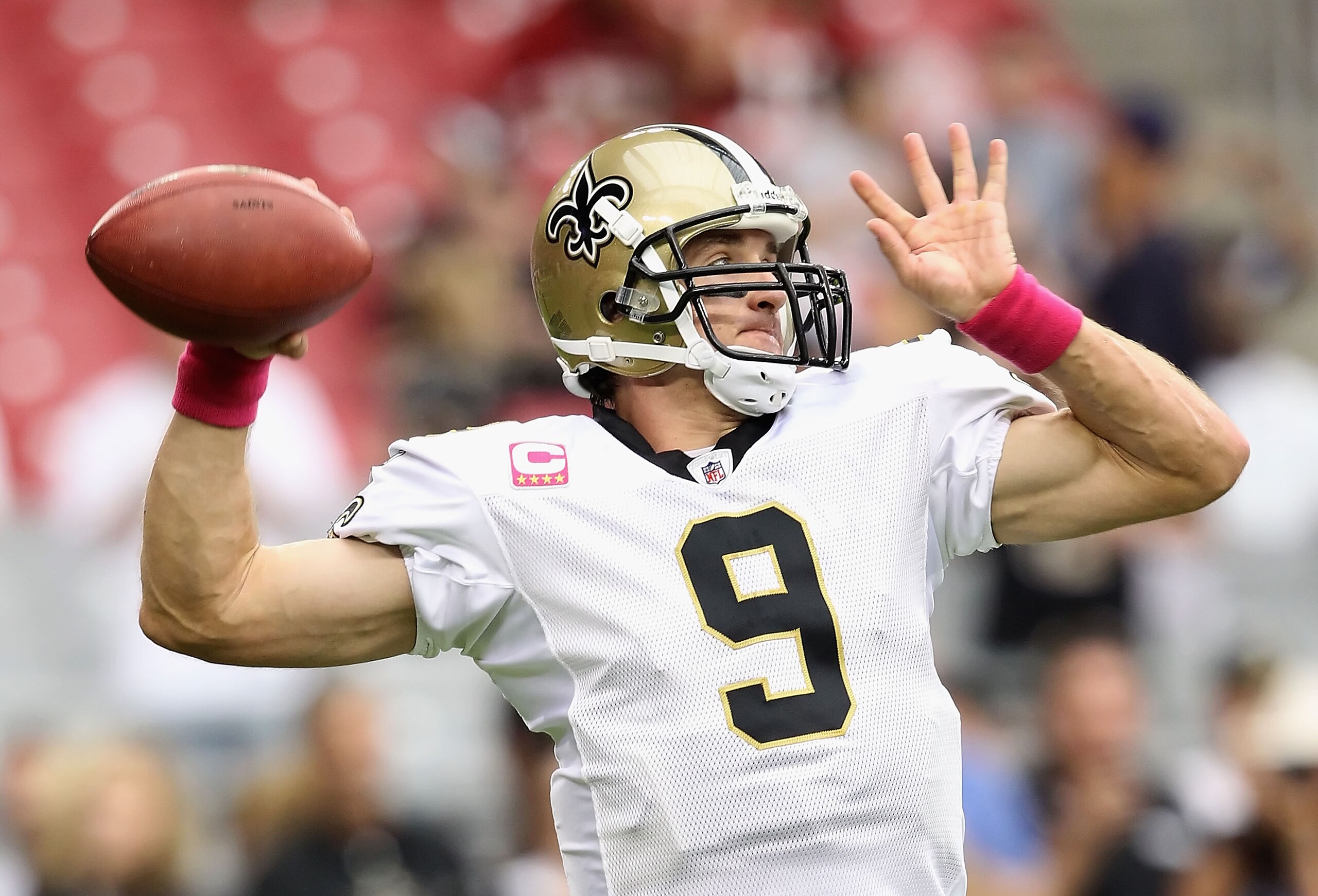 GLENDALE, AZ - OCTOBER 10:  Quarterback Drew Brees #9 of the New Orleans Saints warms up before the NFL game against the Arizona Cardinals at the University of Phoenix Stadium on October 10, 2010 in Glendale, Arizona. The Cardinals defeated the Saints 30-