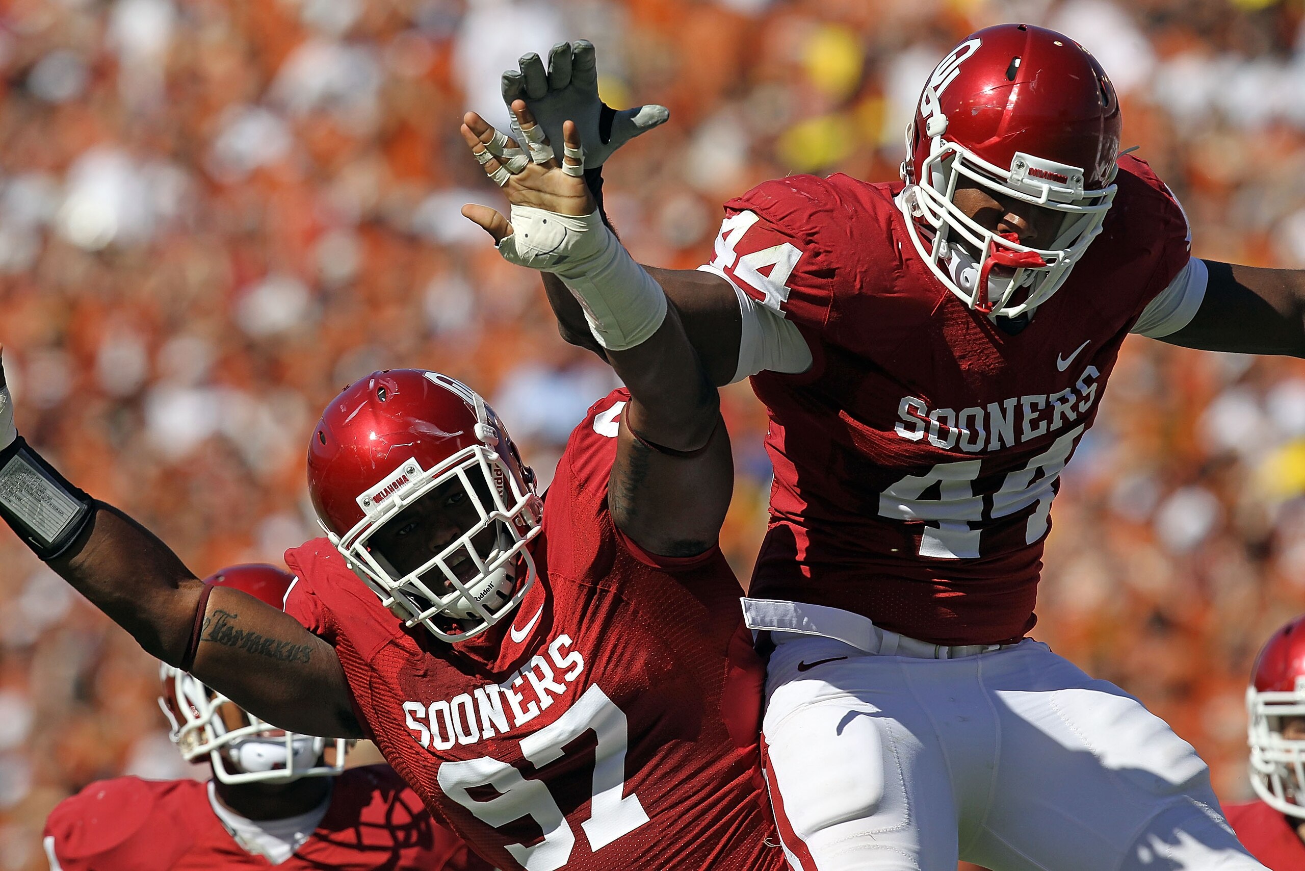 DALLAS - OCTOBER 02: Jeremy Beal #44 and Jamarkus McFarland #97 of the Oklahoma Sooners celebrate a quarterback sack against the Texas Longhorns in the first quarter at the Cotton Bowl on October 2, 2010 in Dallas, Texas. (Photo by Ronald Martinez/Getty DALLAS - OCTOBER 02: Jeremy Beal #44 and Jamarkus McFarland #97 of the Oklahoma Sooners celebrate a quarterback sack against the Texas Longhorns in the first quarter at the Cotton Bowl on October 2, 2010 in Dallas, Texas. (Photo by Ronald Martinez/Getty