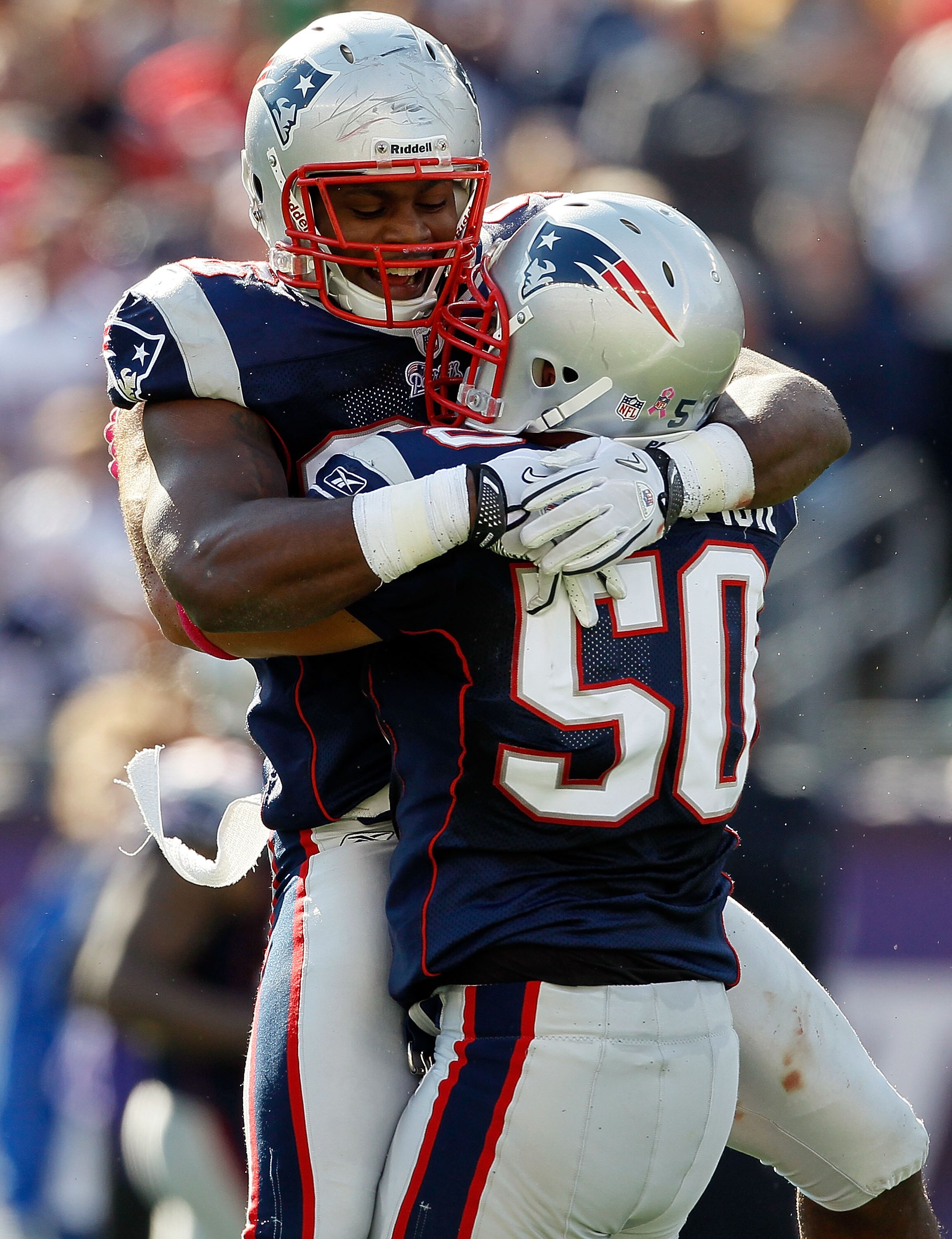 FOXBORO, MA - OCTOBER 17:  Rob Ninkovich #50 of the New England Patriots celebrate with teammate Jermaine Cunningham #96 after Ninkovich sack Joe Flacco #5 of the Baltimore Ravens in the first half at Gillette Stadium on October 17, 2010 in Foxboro, Massa