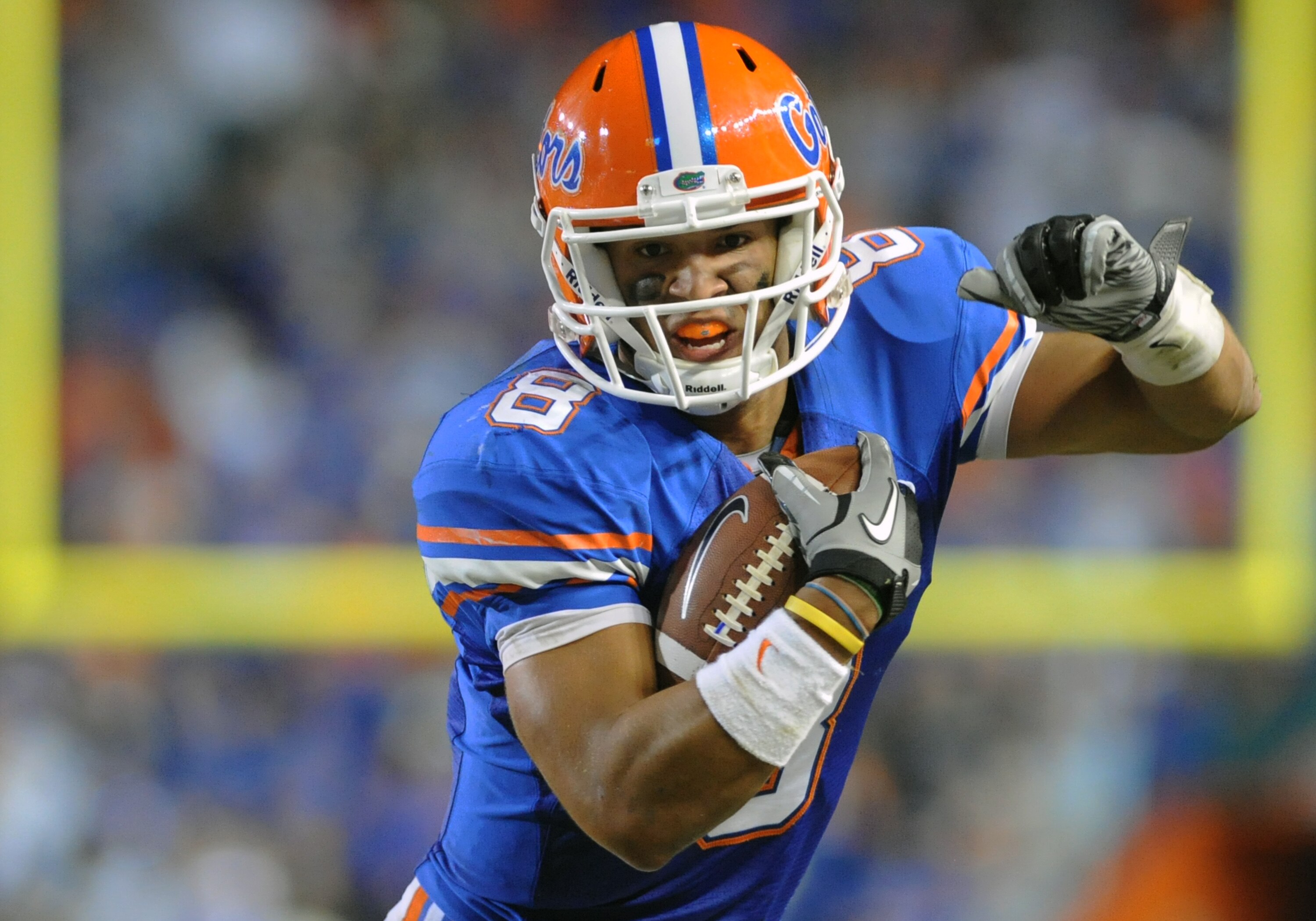 GAINESVILLE, FL - OCTOBER 16:  Quarterback Trey Burton #8 of the Florida Gators rushes upfield against the Mississippi State Bulldogs  October 16, 2010 Ben Hill Griffin Stadium at Gainesville, Florida.  (Photo by Al Messerschmidt/Getty Images)