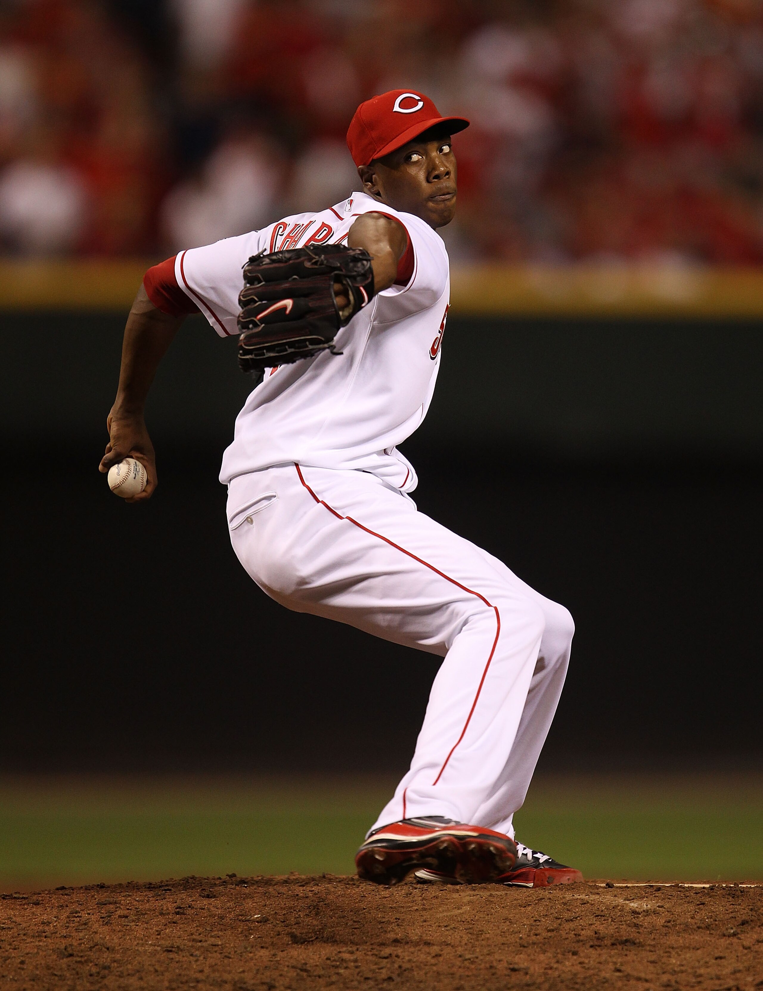 CINCINNATI - OCTOBER 10: Aroldis Chapman #54 of the Cincinnati Reds pitches in the 9th inning against the Philadelphia Phillies during game 3 of the NLDS at Great American Ball Park on October 10, 2010 in Cincinnati, Ohio. The Phillies defeated the Reds 2 CINCINNATI - OCTOBER 10: Aroldis Chapman #54 of the Cincinnati Reds pitches in the 9th inning against the Philadelphia Phillies during game 3 of the NLDS at Great American Ball Park on October 10, 2010 in Cincinnati, Ohio. The Phillies defeated the Reds 2