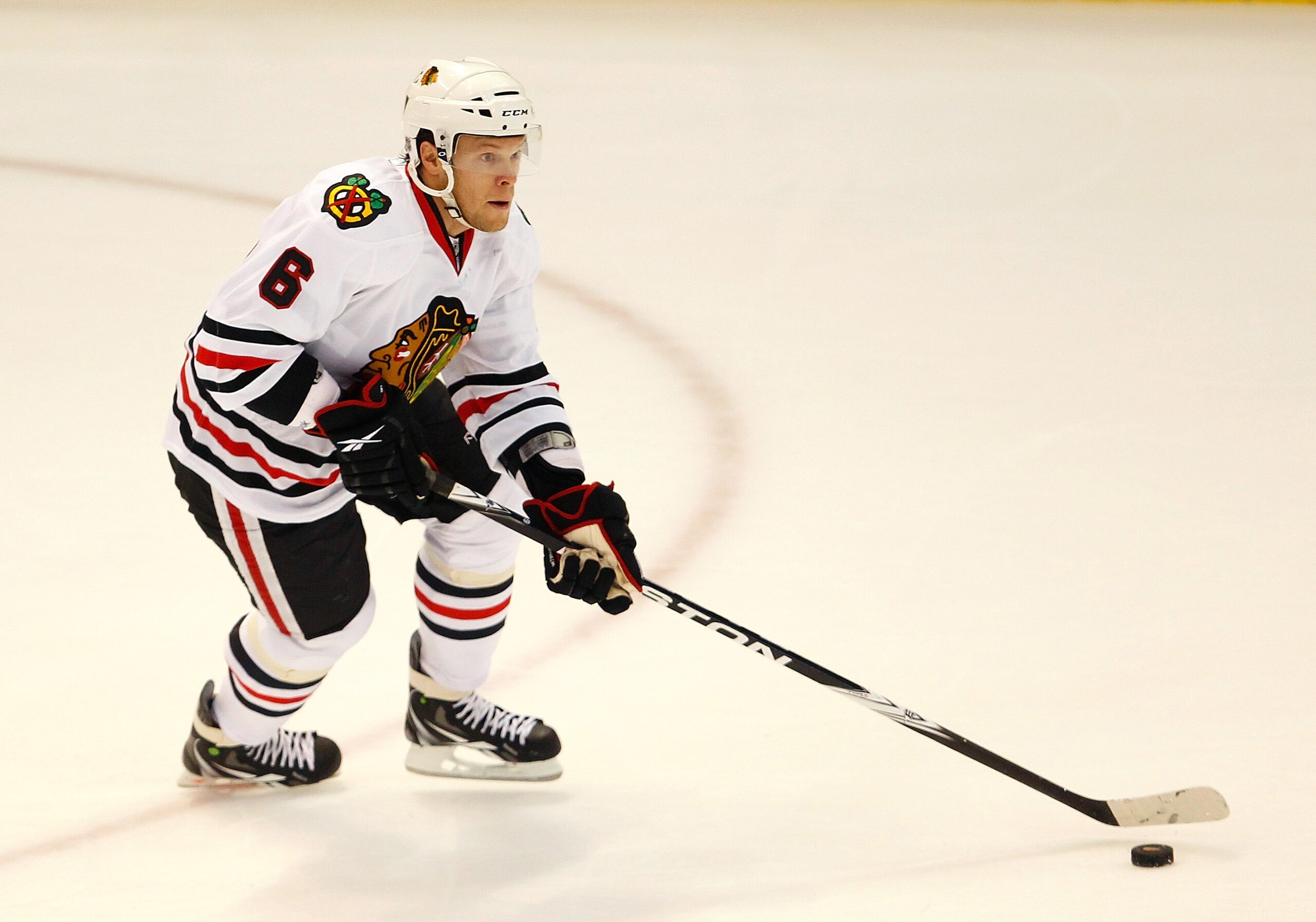 DETROIT - SEPTEMBER 24:  Jordan Hendry #6 of the Chicago Blackhawks moves the puck up ice against the Detroit Red Wings during a pre season game on September 24, 2010 at Joe Louis Arena in Detroit, Michigan.  (Photo by Gregory Shamus/Getty Images)