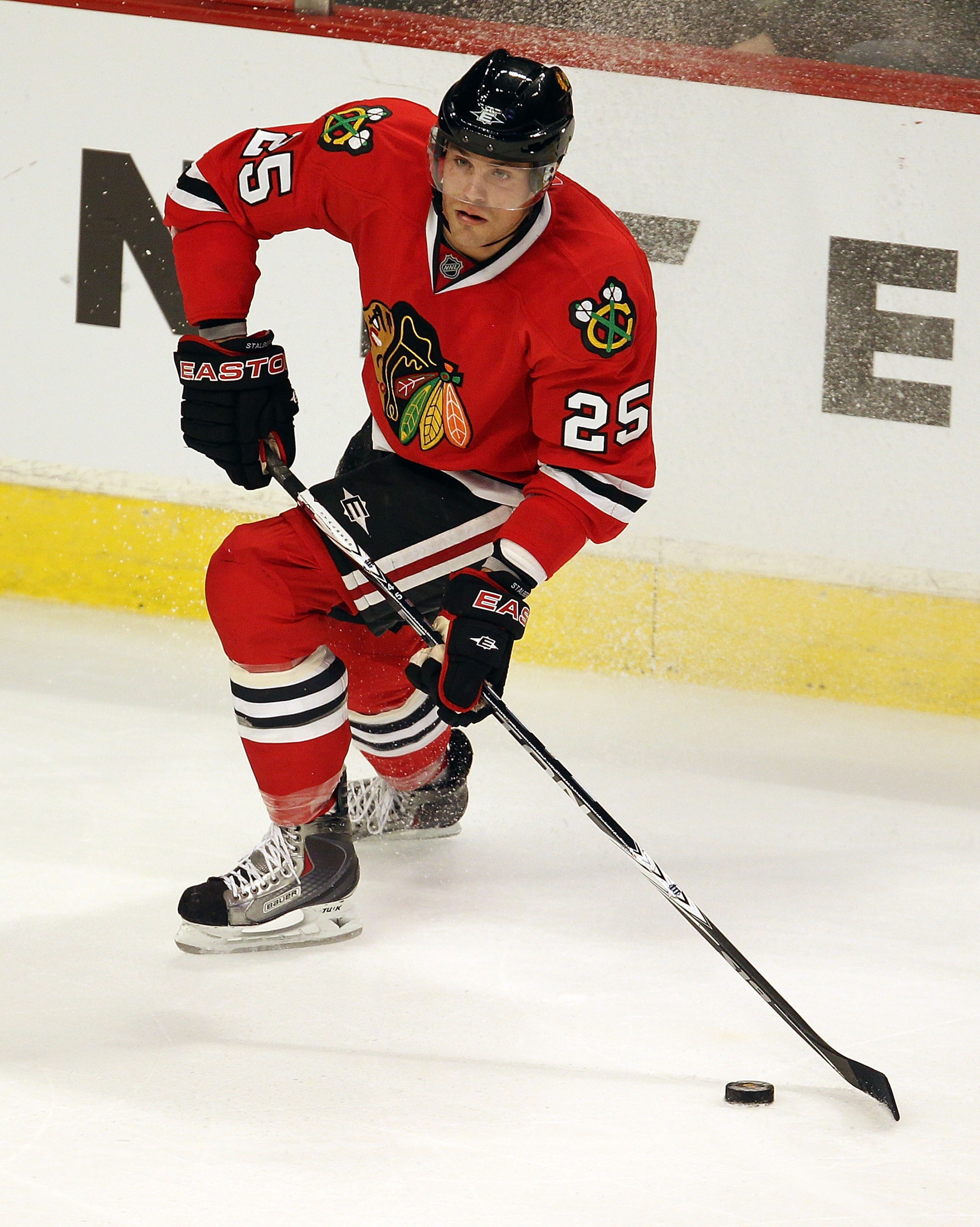 CHICAGO - OCTOBER 09: Viktor Stalberg #25 of the Chicago Blackhawks looks to pass against the Detroit Red Wings during the Blackhawks season home opening game at the United Center on October 9, 2010 in Chicago, Illinois. The Red Wings defeated the Blackha