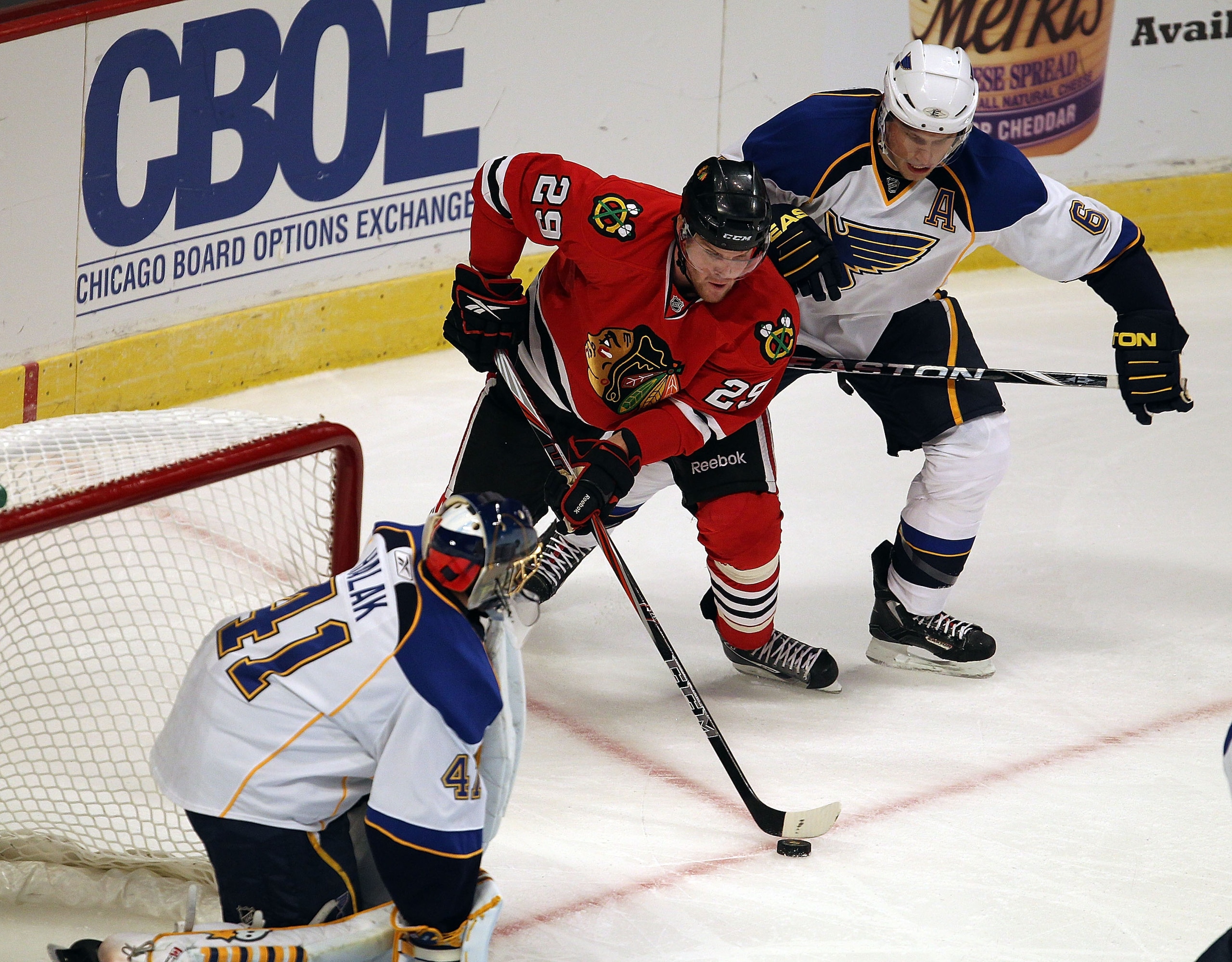 CHICAGO - OCTOBER 18: Bryan Bickell #29 of the Chicago Blackhawks moves to shoot at Jaroslav Halak #41 of the St. Louis Blues under defensive pressure from Erik Johnson #6 at the United Center on October 18, 2010 in Chicago, Illinois. (Photo by Jonathan D