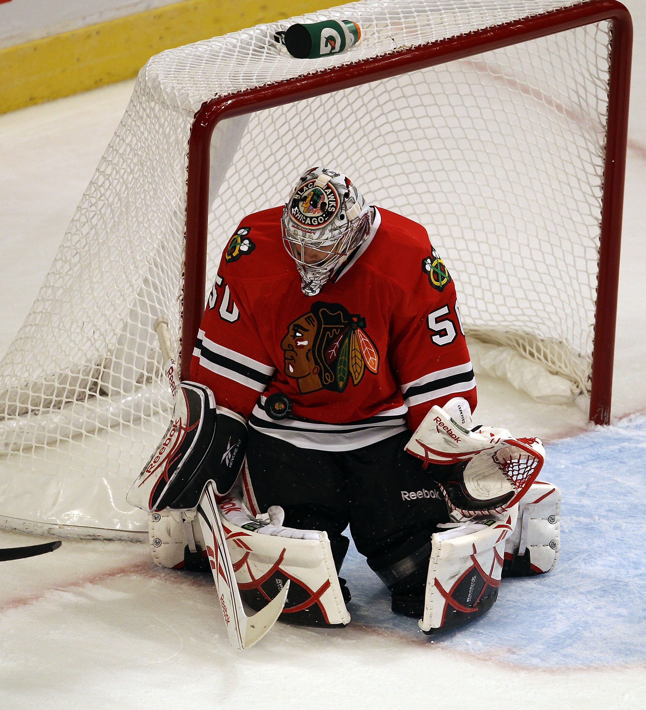 CHICAGO - OCTOBER 13: Corey Crawford #50 of the Chicago Blackhawks stops a shot by Steve Sullivan of the Nashville Predators at the United Center on October 13, 2010 in Chicago, Illinois. The Predators defeated the Blackhawks 3-2. (Photo by Jonathan Danie