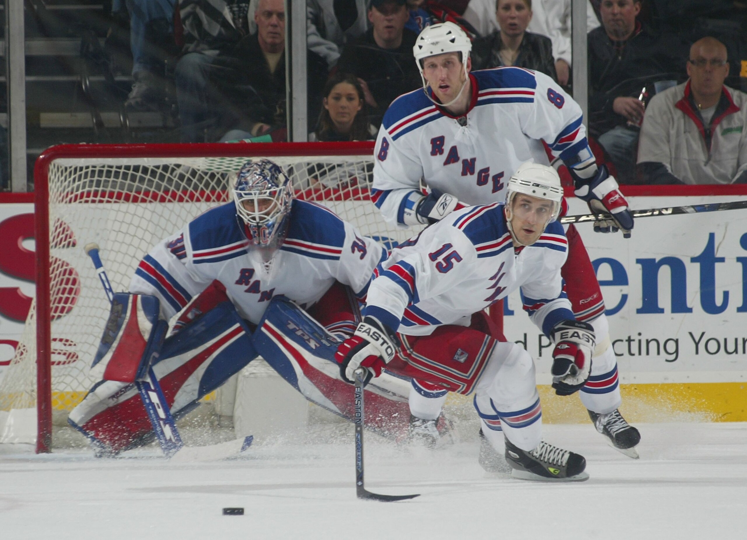 NEWARK, NJ - MARCH 19: Henrik Lunqvist #30, Marek Malik #8 and Blair Betts #15 of the New York Rangers skate against the New Jersey Devils on March 19, 2008 at the Prudential Center in  Newark, New Jersey.  (Photo by Bruce Bennett/Getty Images)