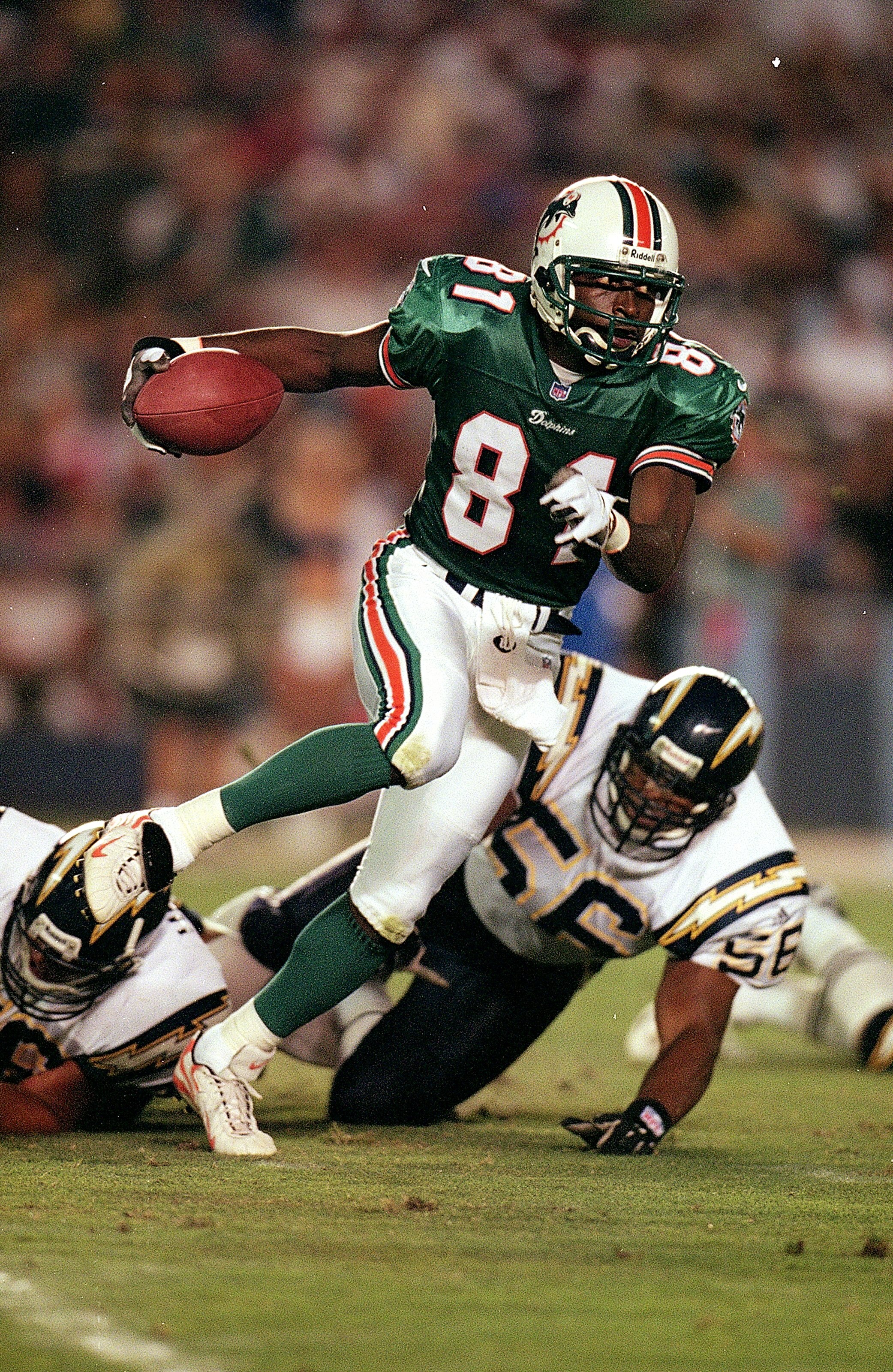 21 Aug 1999:  O.J. McDuffie #81 of the Miami Dolphins carries the ball during the game against the San Diego Chargers at the Qualcomm Stadium in San Diego, California. The Dolphins defeated the Chargers 13-10. Mandatory Credit: Tom Hauck/Allsport