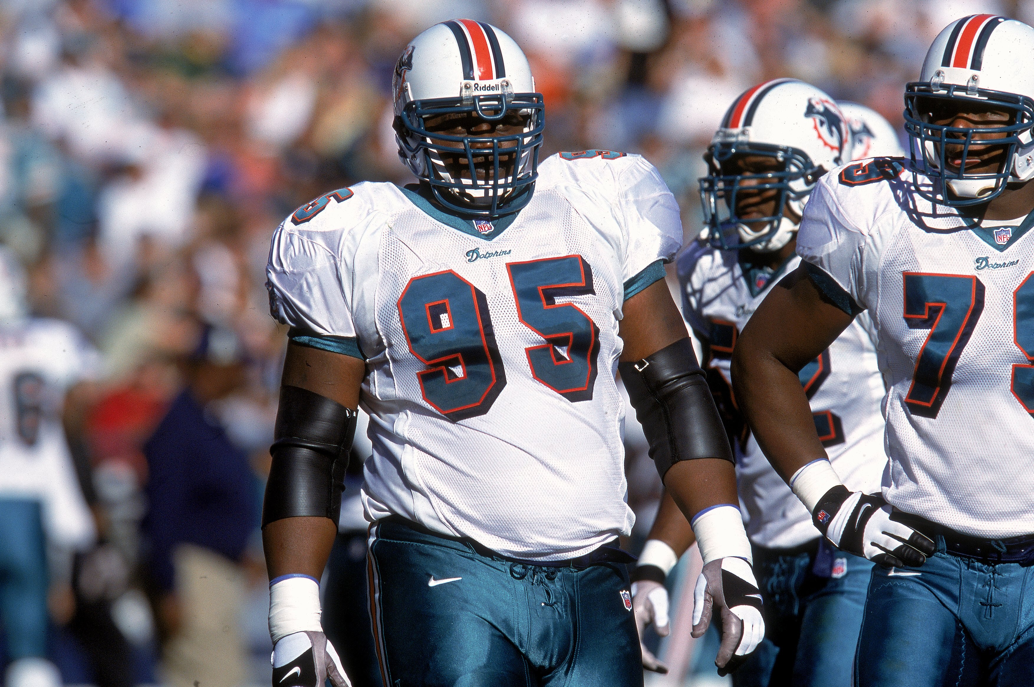 SAN DIEGO - NOVEMBER 12:  Tim Bowens #95 of the Miami Dolphins walks on the field during the game against the San Diego Chargers on November 12, 2000 at the Qualcomm Stadium in San Diego, California.  The Dolphins defeated the Chargers 17-7. (Photo by Ste