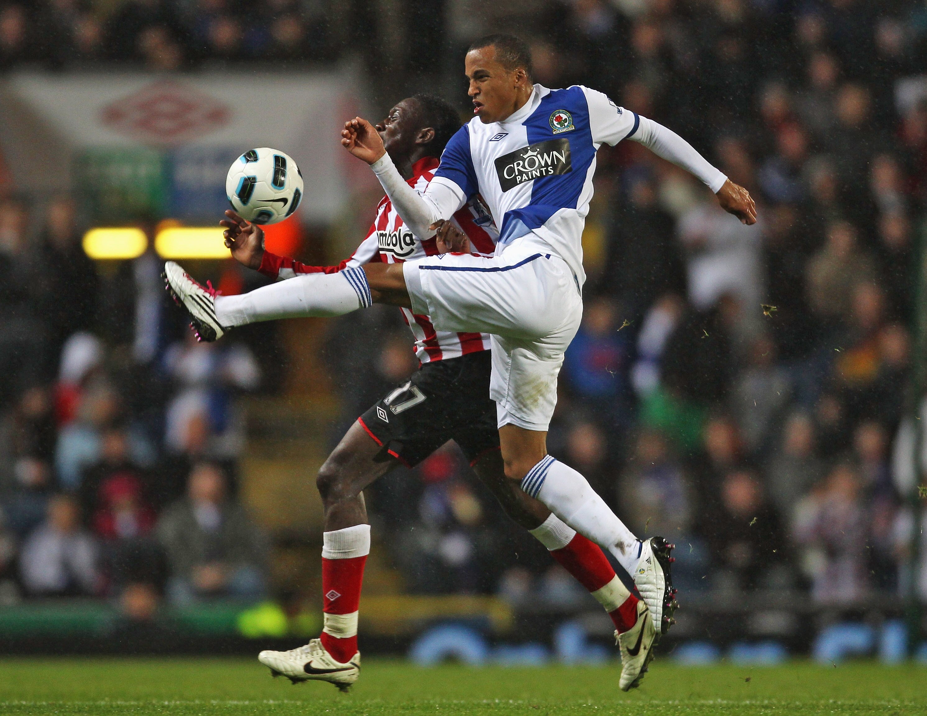BLACKBURN, ENGLAND - OCTOBER 18:  Martin Olsson of Blackburn Rovers tackles Danny Welbeck of Sunderland during the Barclays Premier League match between Blackburn Rovers and Sunderland  at Ewood park on October 18, 2010 in Blackburn, England.  (Photo by A