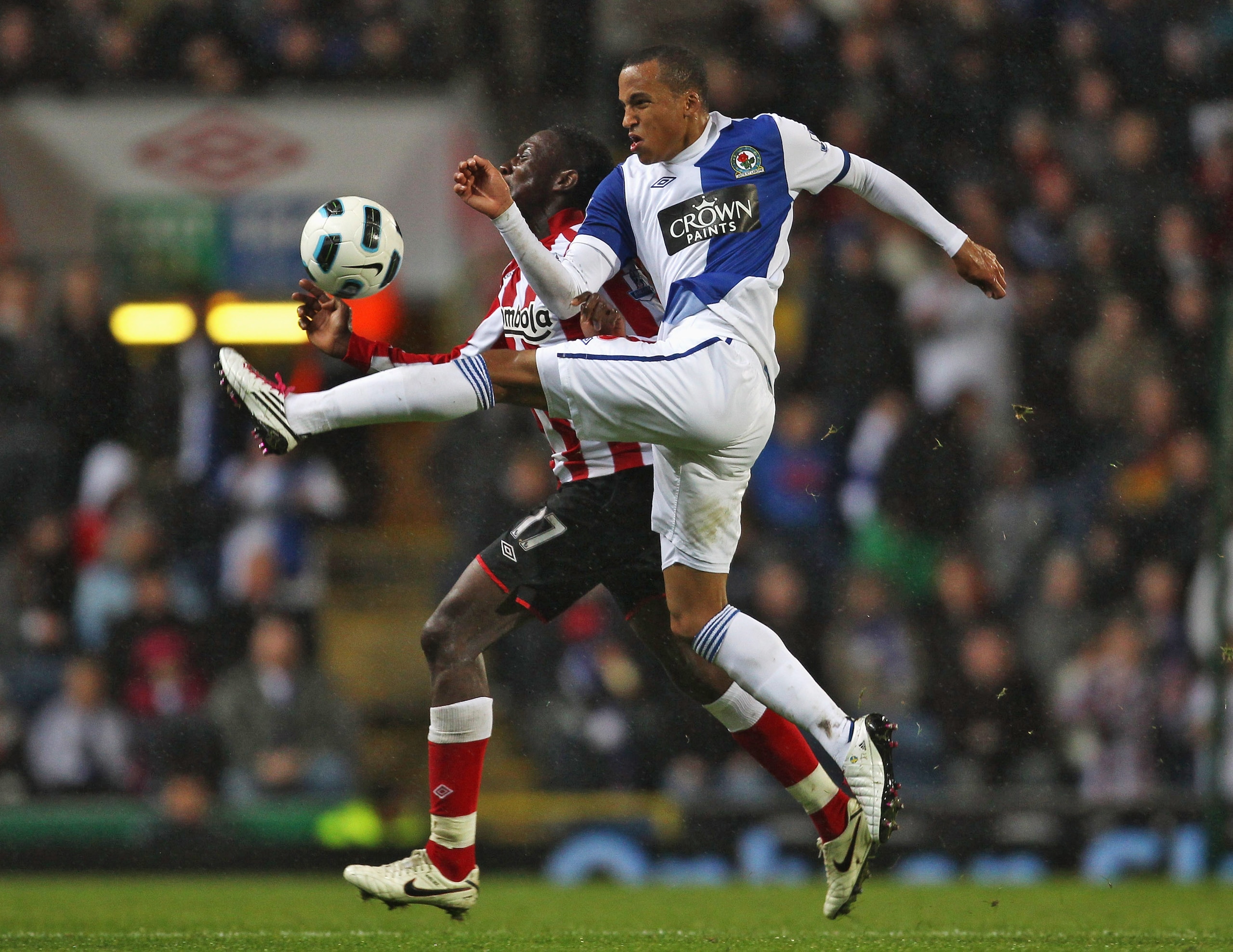 BLACKBURN, ENGLAND - OCTOBER 18:  Martin Olsson of Blackburn Rovers tackles Danny Welbeck of Sunderland during the Barclays Premier League match between Blackburn Rovers and Sunderland  at Ewood park on October 18, 2010 in Blackburn, England.  (Photo by A