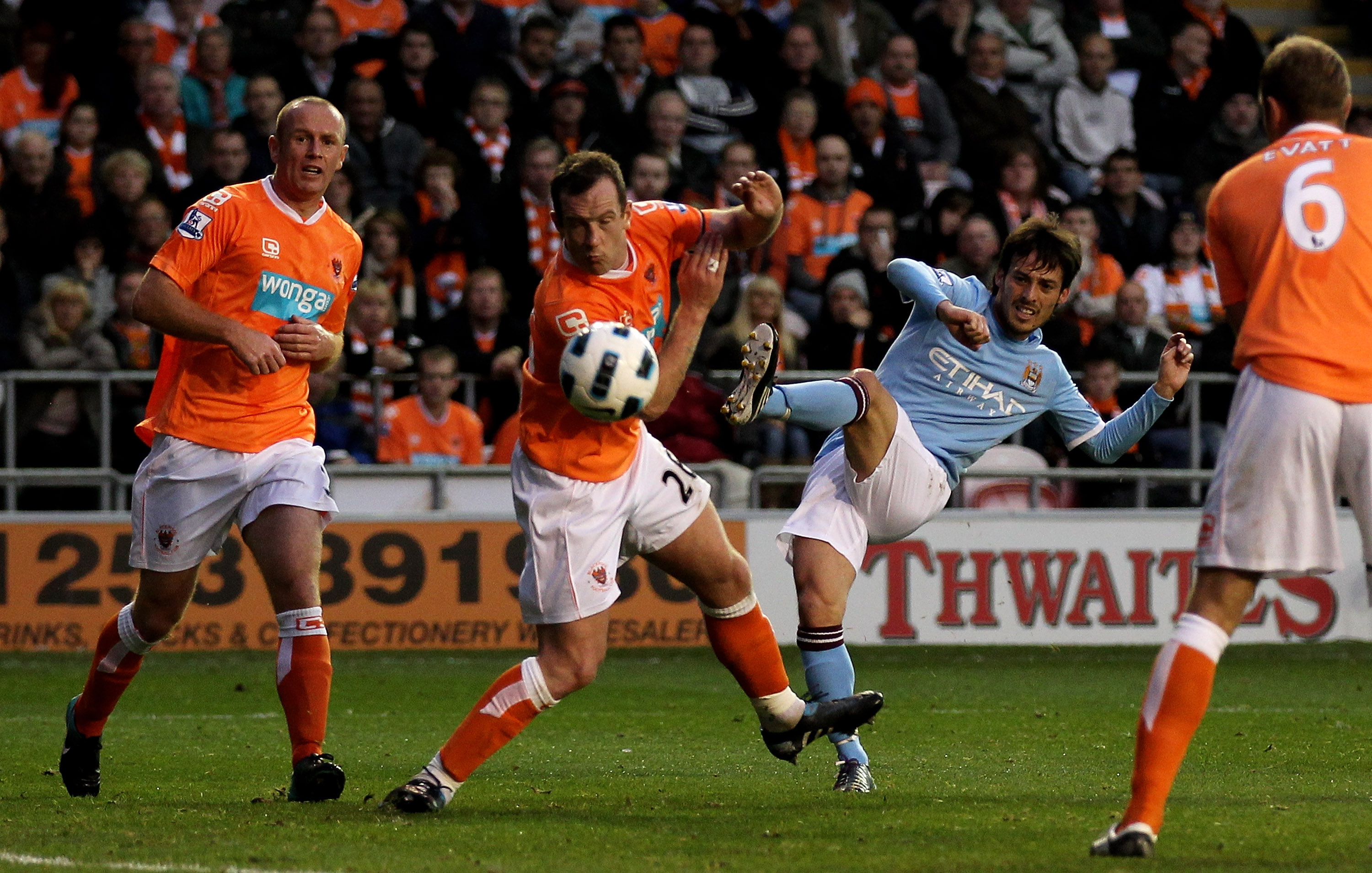 BLACKPOOL, ENGLAND - OCTOBER 17:   David Silva of Manchester City scores his team's third goal during the Barclays Premiership match between Blackpool and Manchester City at Bloomfield Road on October 17, 2010 in Blackpool, England. (Photo by Alex Livesey