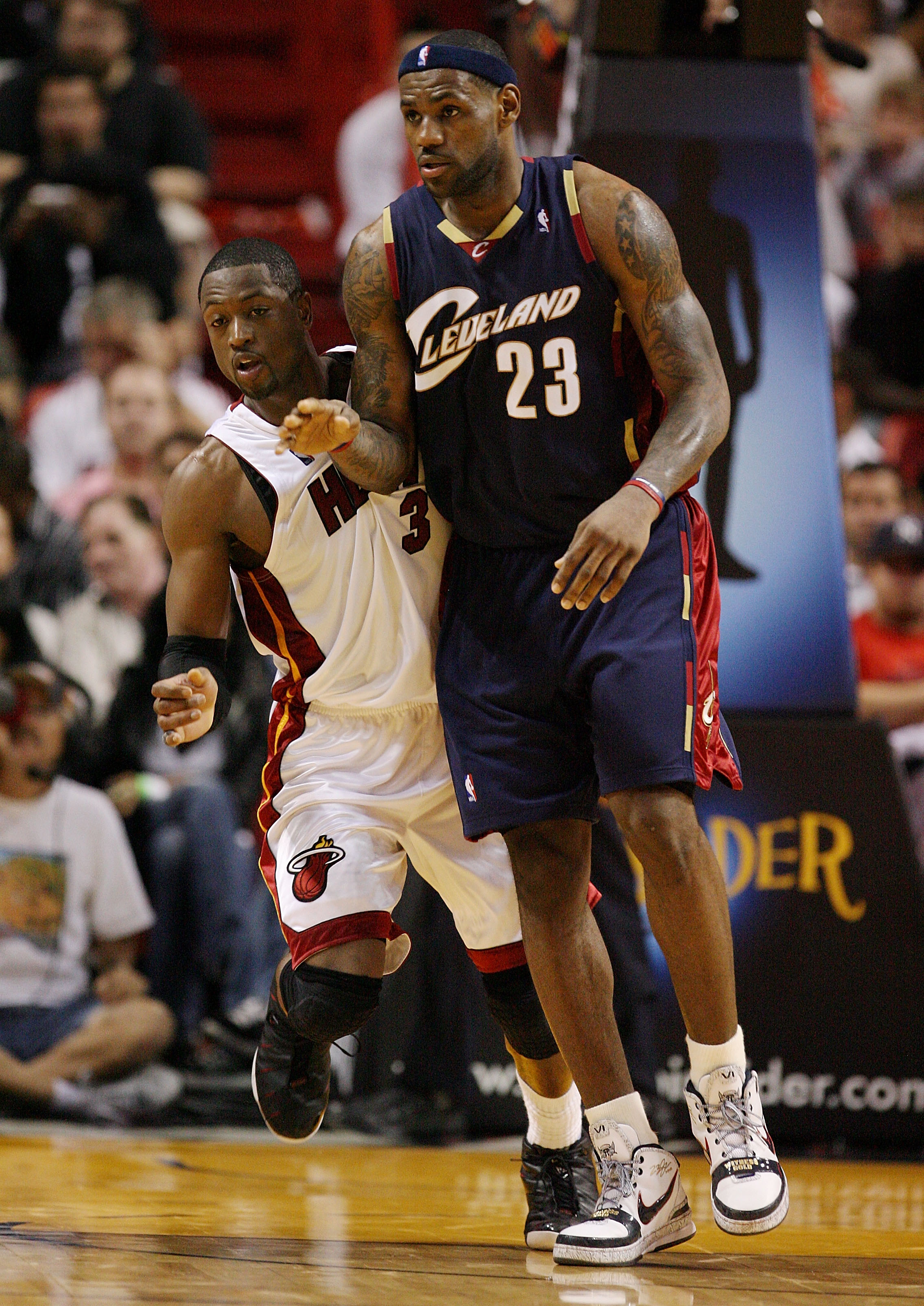 MIAMI - DECEMBER 30:  LeBron James #23 of the Cleveland Cavaliers is guarded closely by Dwyane Wade #3 of the Miami Heat at American Airlines Arena on December 30, 2008 in Miami, Florida. The Heat defeated the Cavaliers 104-95. NOTE TO USER: User expressl