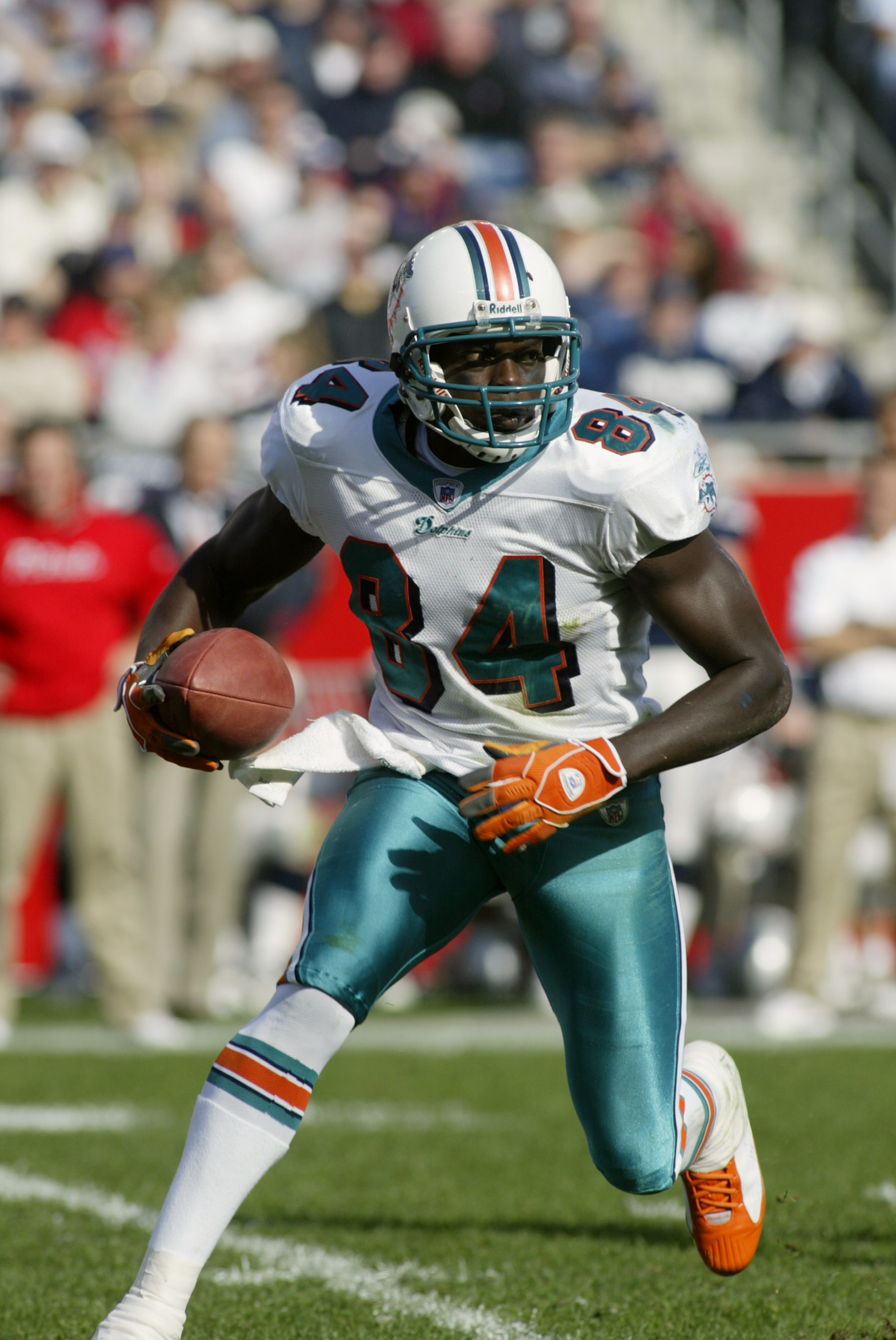 FOXBORO, MA - OCTOBER 10:  Wide receiver Chris Chambers #84 of the Miami Dolphins carries the ball against the New England Patriots at Gillette Stadium on October 10, 2004 in Foxboro, Massachusetts. The Patriots defeated the Dolphins 24-10 for their NFL r
