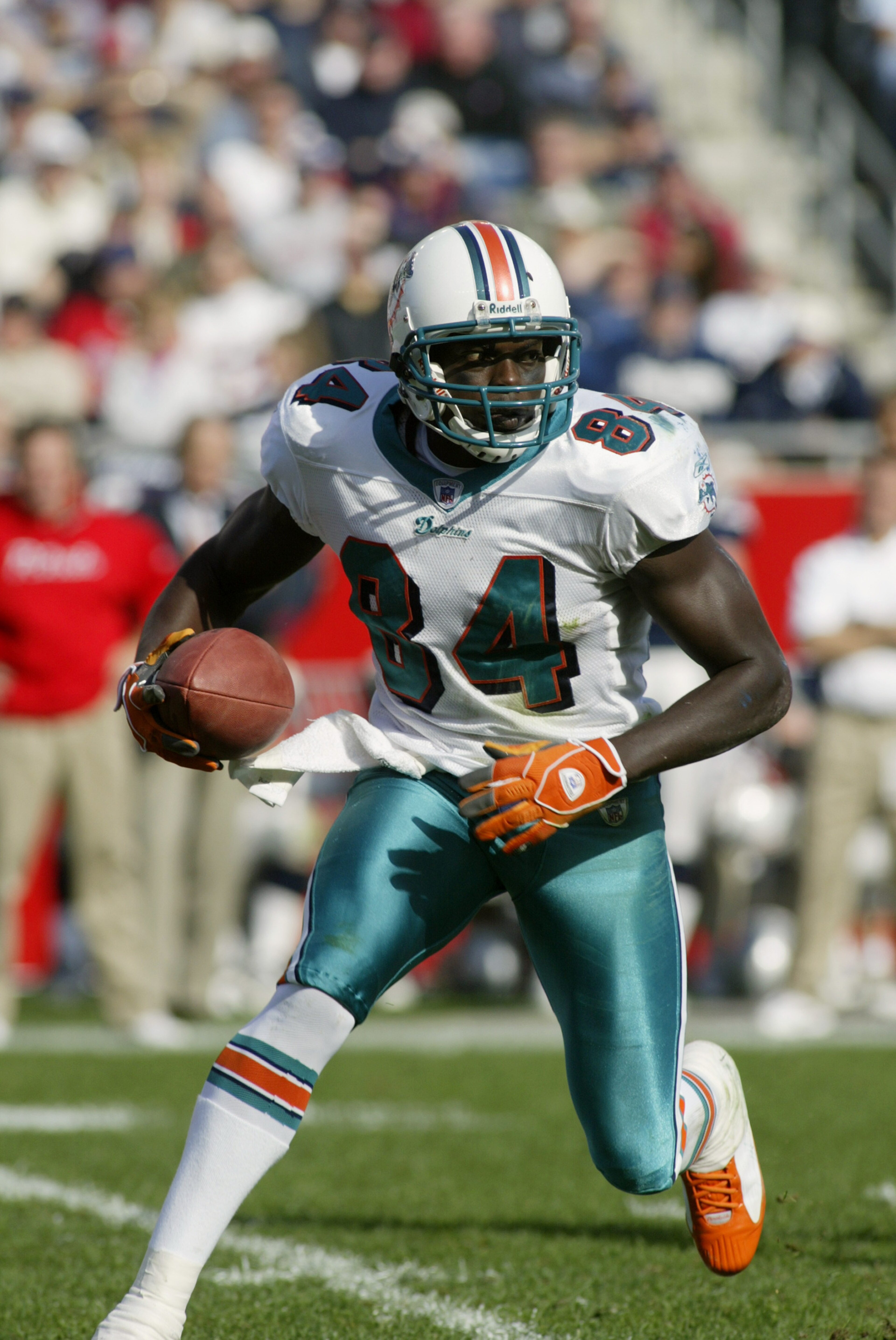 FOXBORO, MA - OCTOBER 10:  Wide receiver Chris Chambers #84 of the Miami Dolphins carries the ball against the New England Patriots at Gillette Stadium on October 10, 2004 in Foxboro, Massachusetts. The Patriots defeated the Dolphins 24-10 for their NFL r