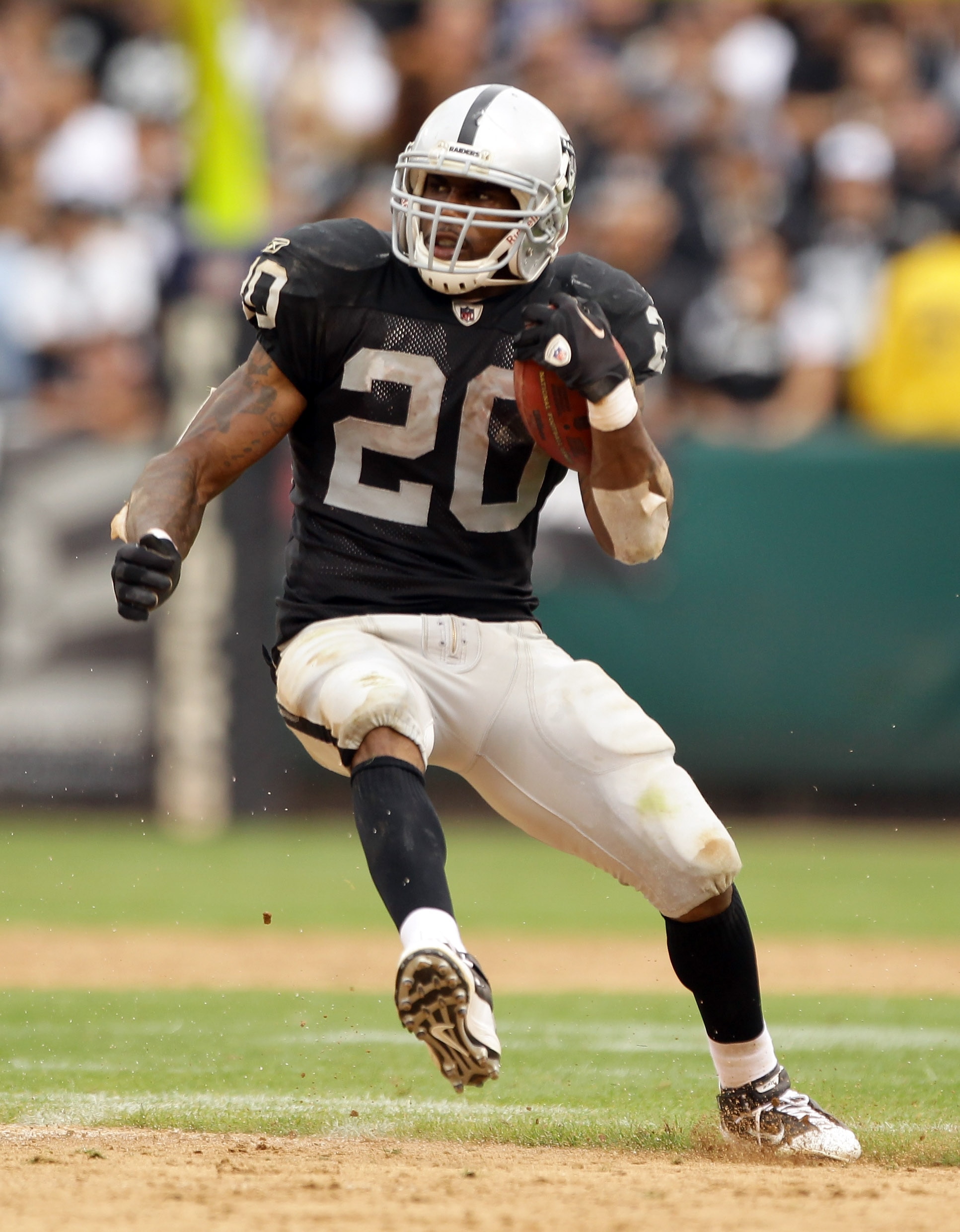 OAKLAND, CA - SEPTEMBER 19: Darren McFadden #20 of the Oakland Raiders runs with the ball during their game against the St. Louis Rams at the Oakland-Alameda County Coliseum on September 19, 2010 in Oakland, California. (Photo by Ezra Shaw/Getty Images) OAKLAND, CA - SEPTEMBER 19: Darren McFadden #20 of the Oakland Raiders runs with the ball during their game against the St. Louis Rams at the Oakland-Alameda County Coliseum on September 19, 2010 in Oakland, California. (Photo by Ezra Shaw/Getty Images)