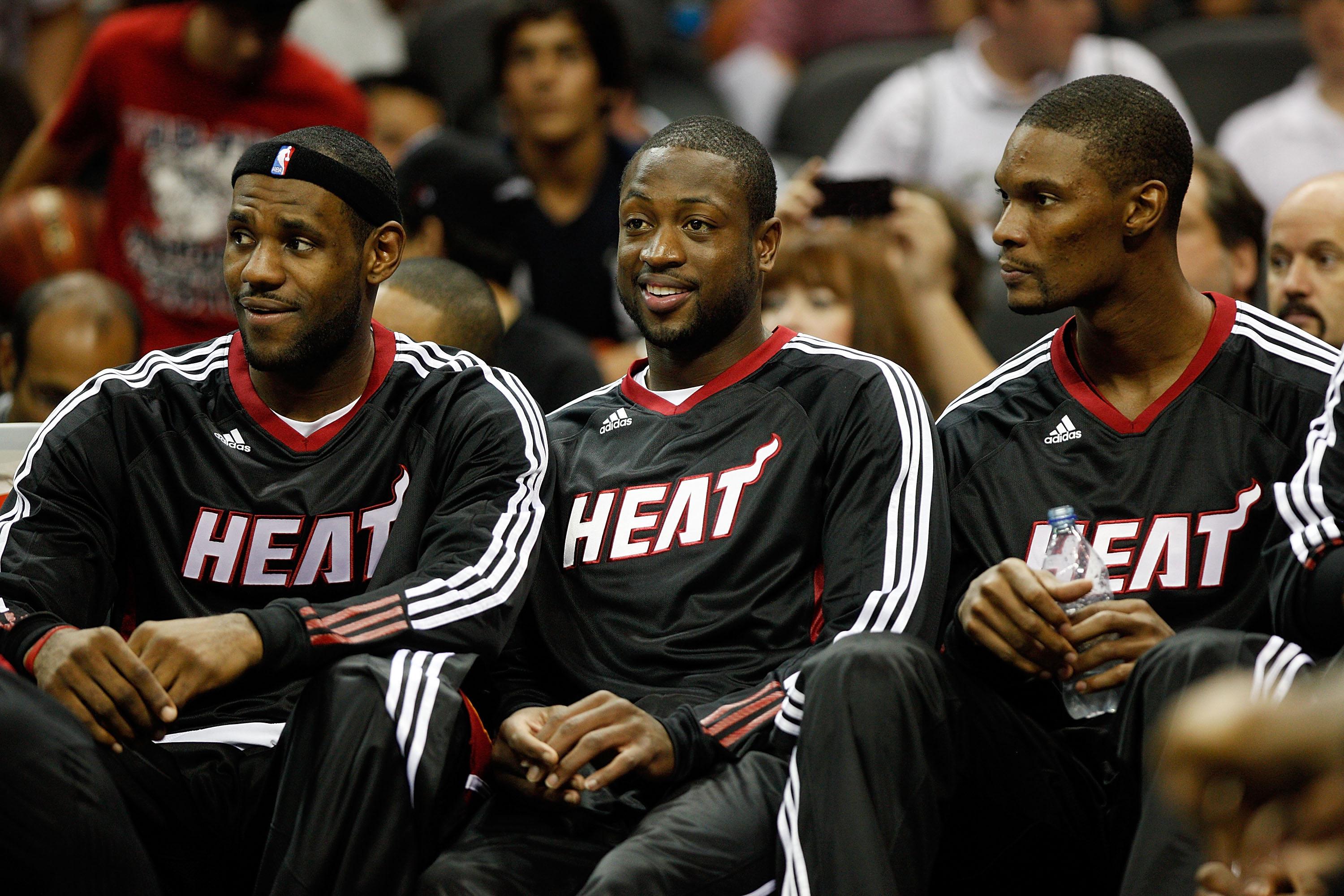 SAN ANTONIO - OCTOBER 09:  LeBron James #6, Dwayne Wade #3, and Chris Bosh #1 of the Miami Heat sit on the bench during the game against the San Antonio Spurs at the AT&T Center on October 9, 2010 in San Antonio, Texas.  NOTE TO USER: User expressly ackno