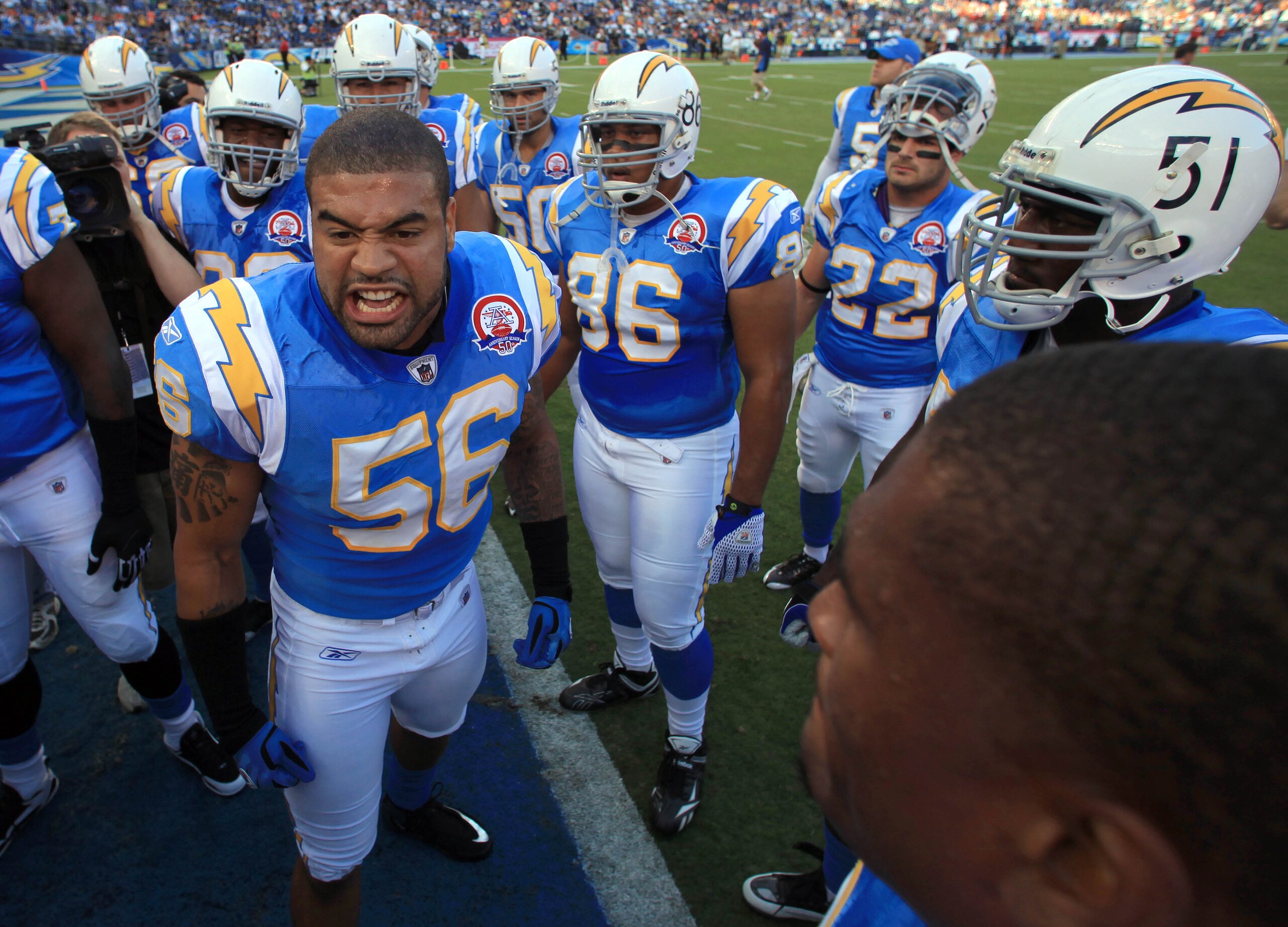 SAN DIEGO, CA - OCTOBER 19:  Linebacker Shawn Merriman #56 of the San Diego Chargers leads the team in a cheer before the start of the game against the Denver Broncos during Monday Night Football on October 19, 2009 at Qualcomm Stadium in San Diego, Calif